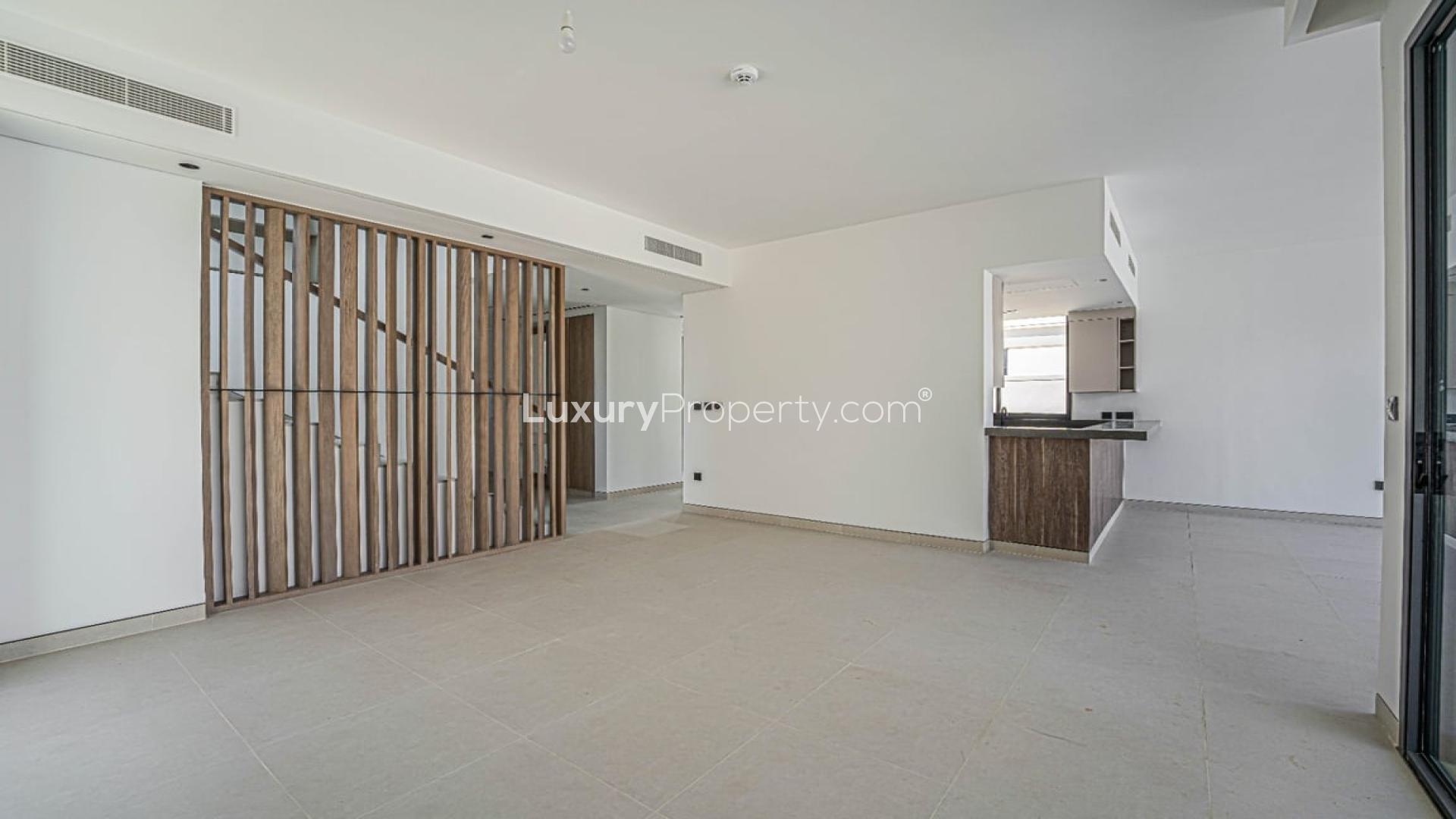 Spacious villa interior with large windows in Harmony, Tilal Al Ghaf, available for rent