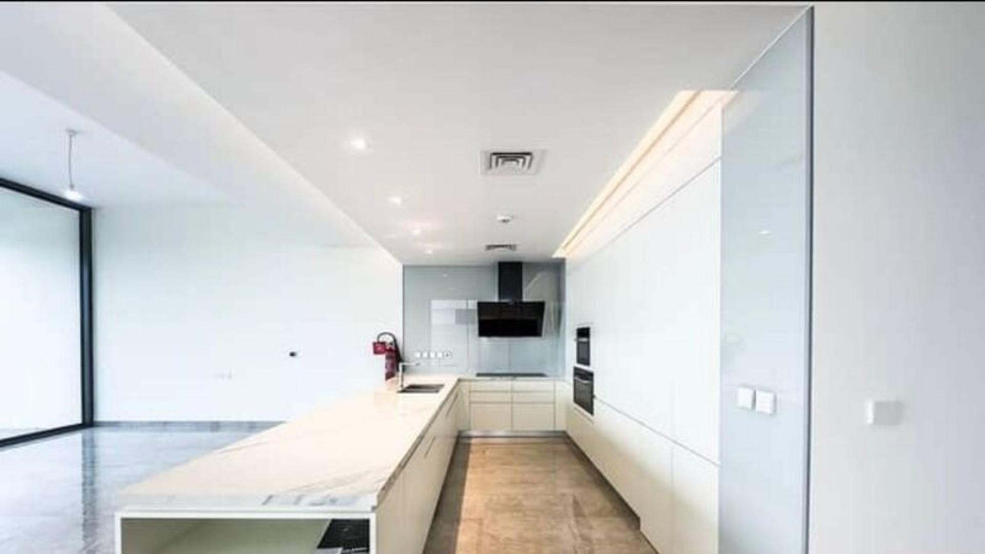 Spacious modern kitchen and living area in District One villa, Mohammed Bin Rashid City