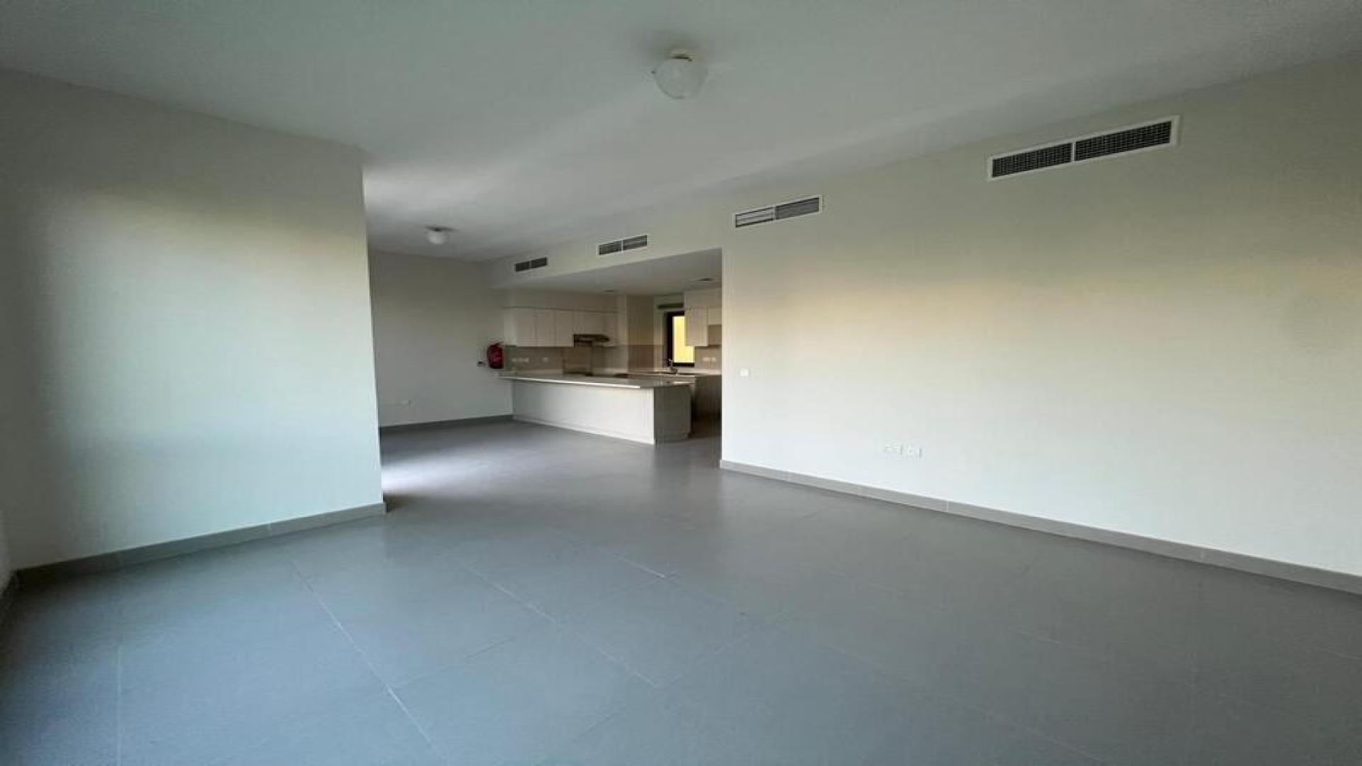 Villa interior with large windows overlooking garden at Maple, Dubai Hills Estate