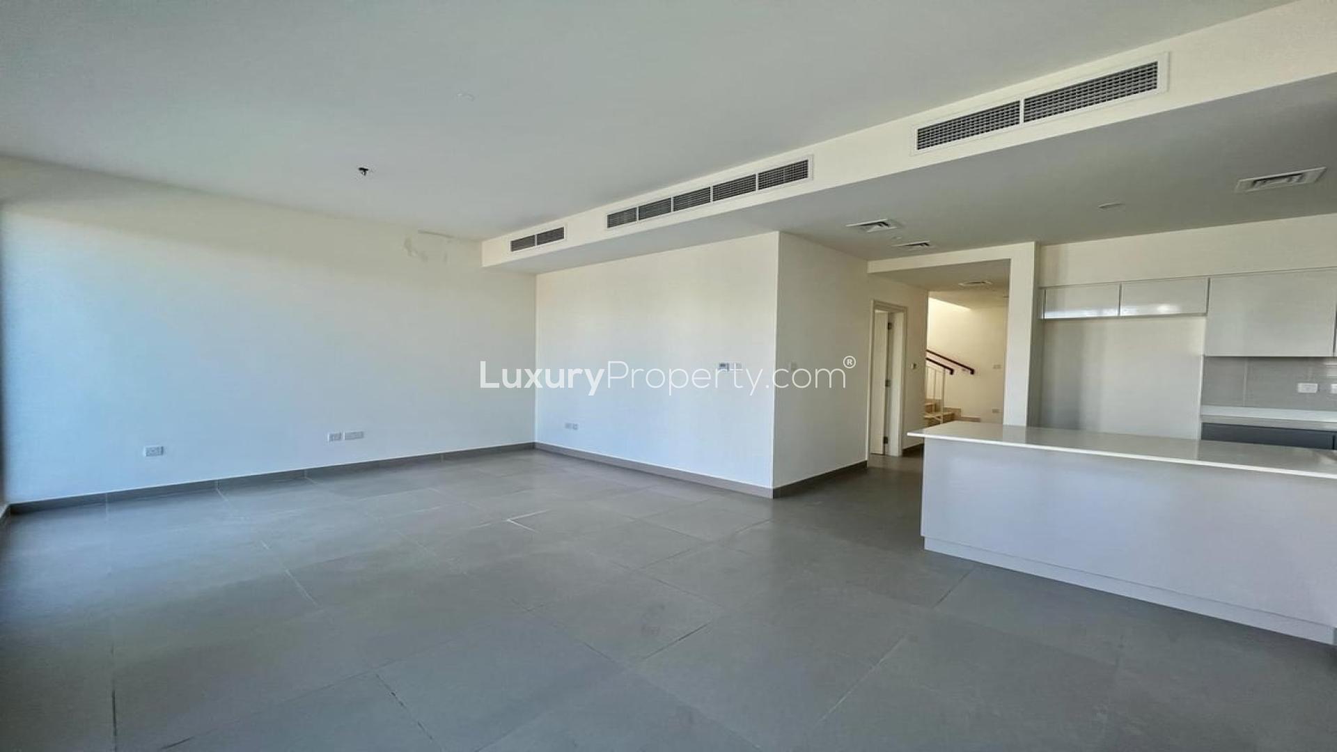Modern kitchen and living area in corner unit villa, Dubai Hills Estate, Maple community