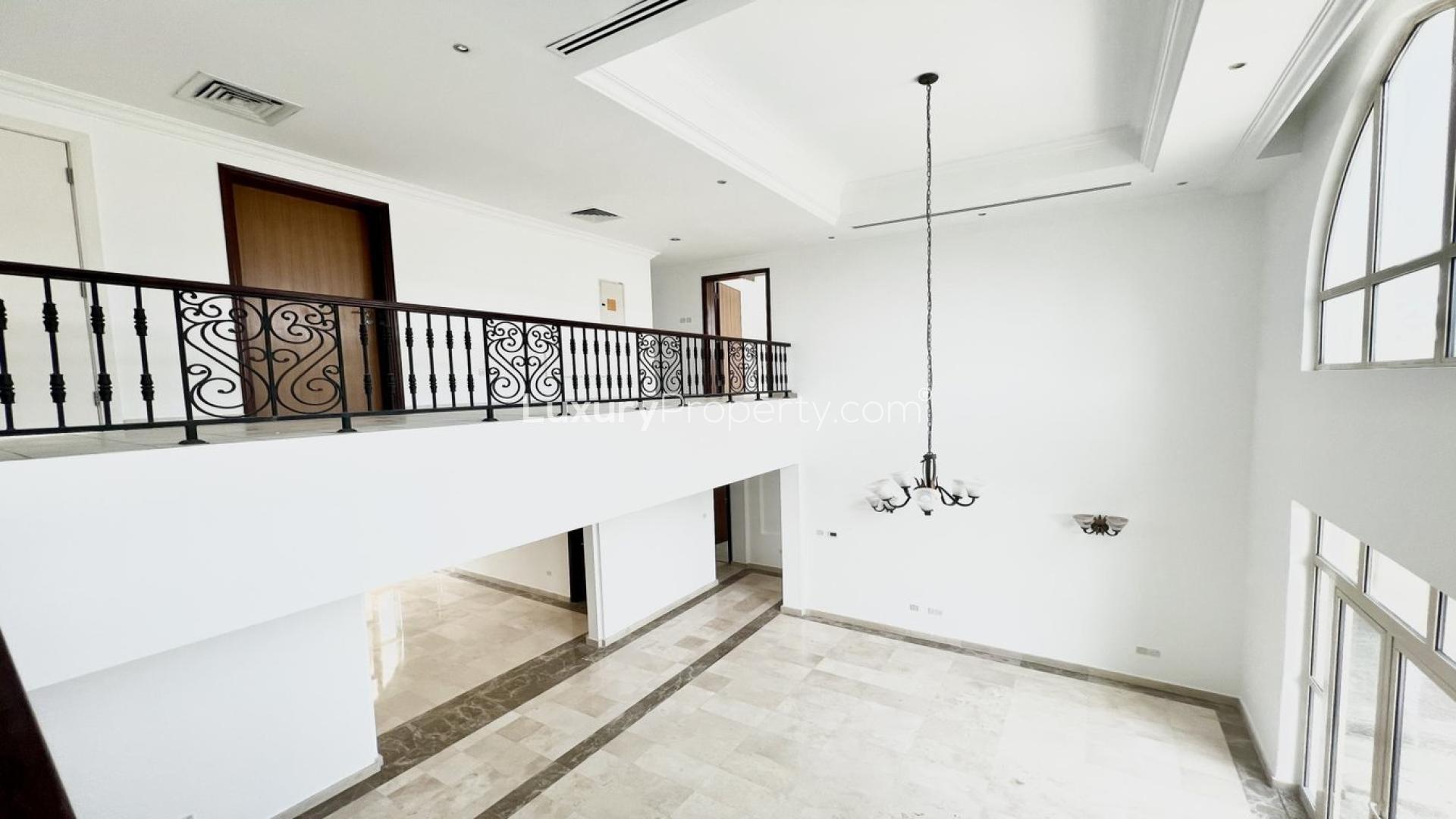 Luxurious Jumeirah Islands villa interior with elegant staircase and large windows