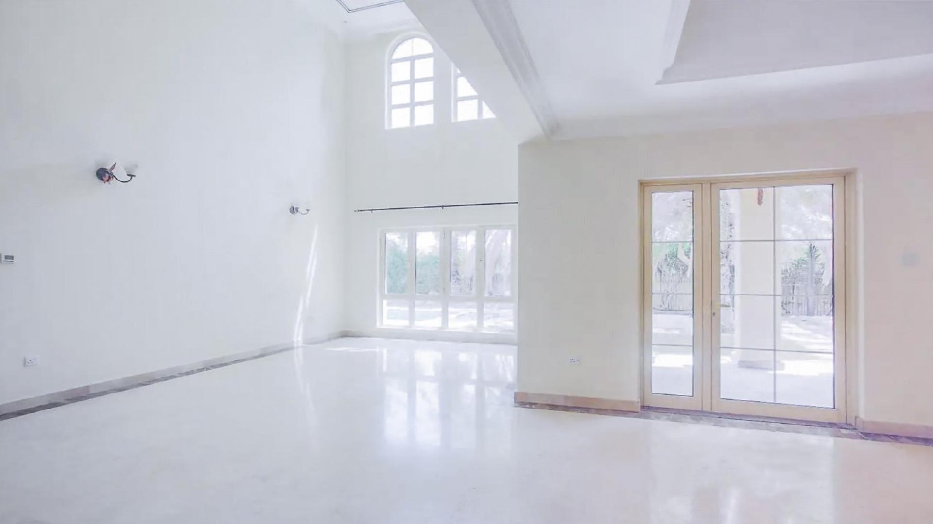 Spacious living area with large windows in Jumeirah Islands villa, Mediterranean Clusters