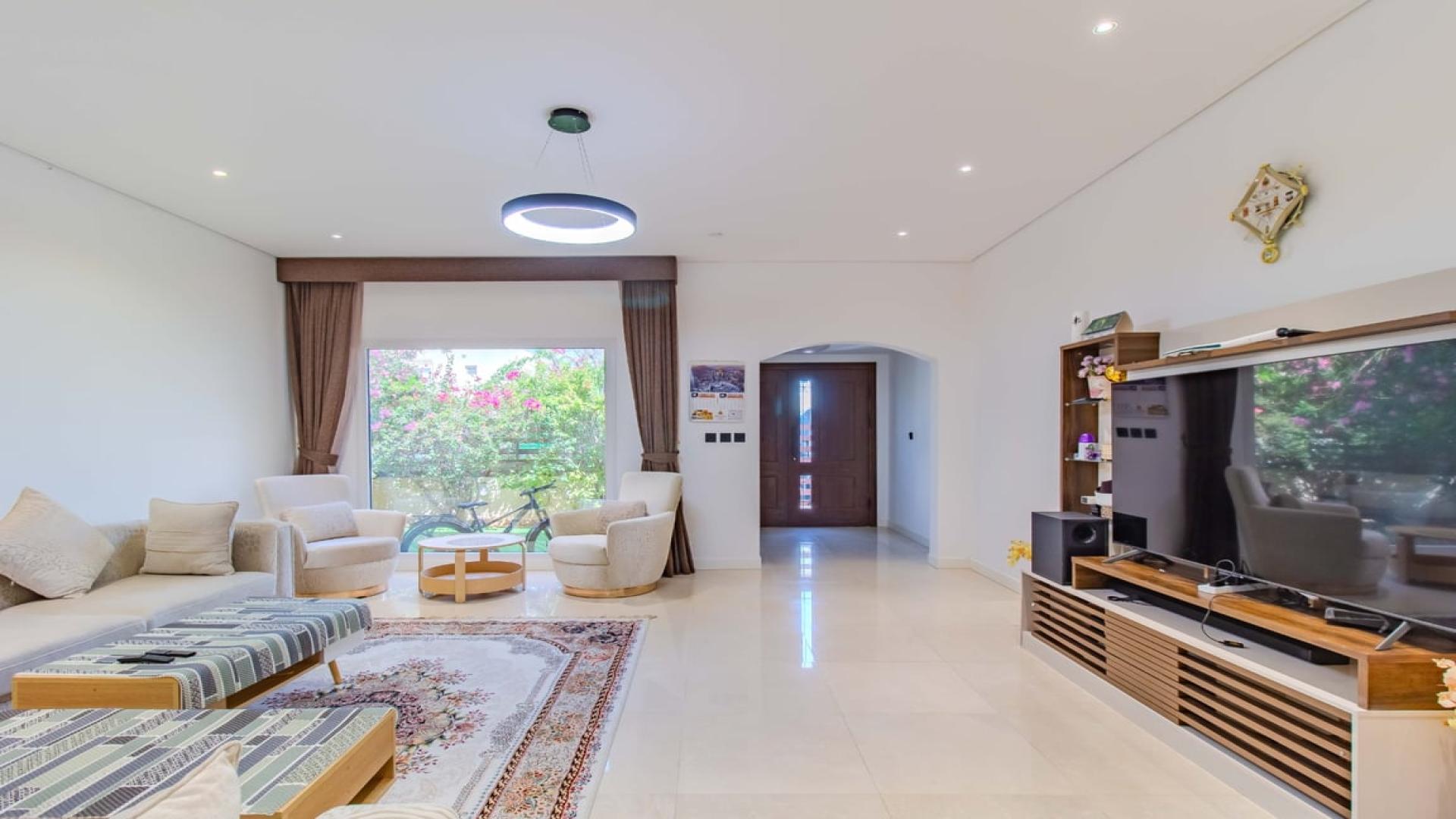 Luxurious living room in 4-bedroom villa, Meadows 9, Dubai, with modern decor and spacious layout