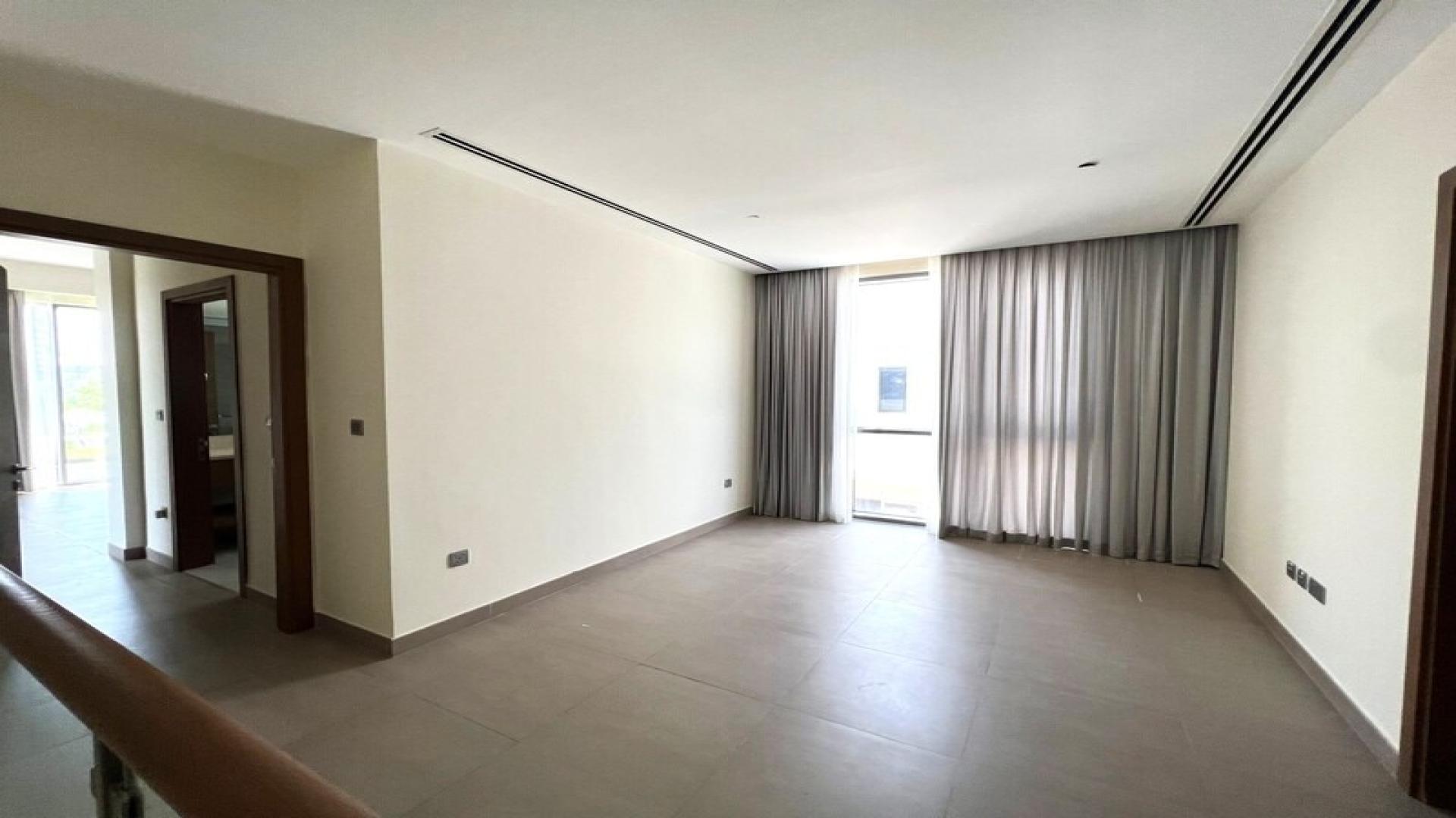 Spacious living room with large windows in Sidra Villas, Dubai Hills Estate, available for rent