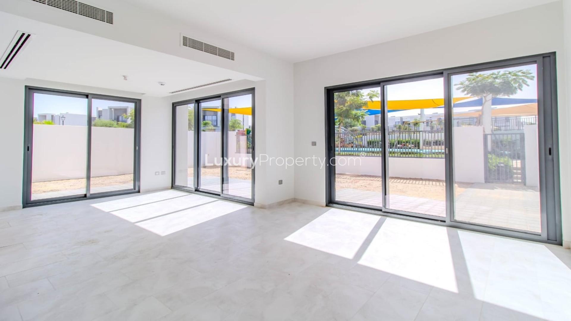 Bright living room with large windows in Villanova, Dubai Land villa for rent