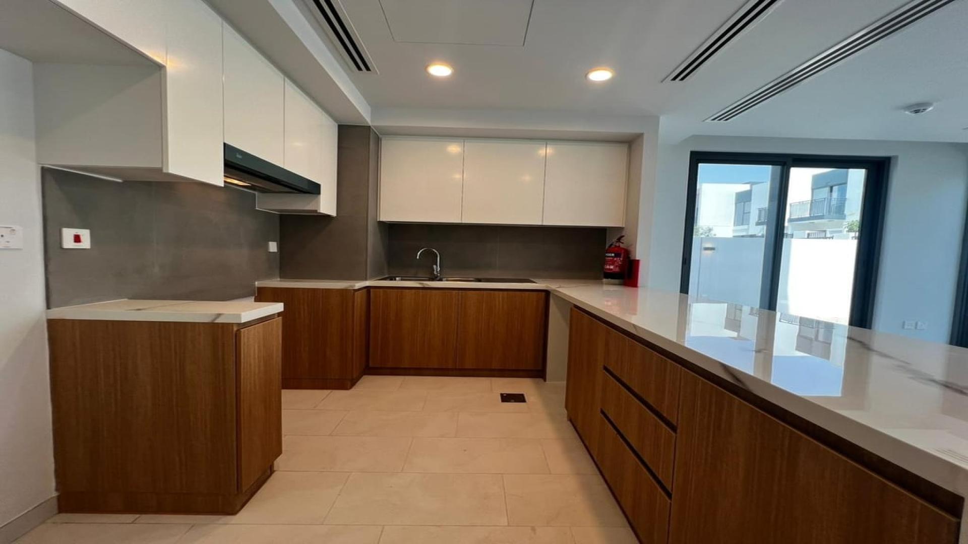 Modern kitchen in brand new 4-bedroom villa, Villanova, Dubai Land, for rent June 1st