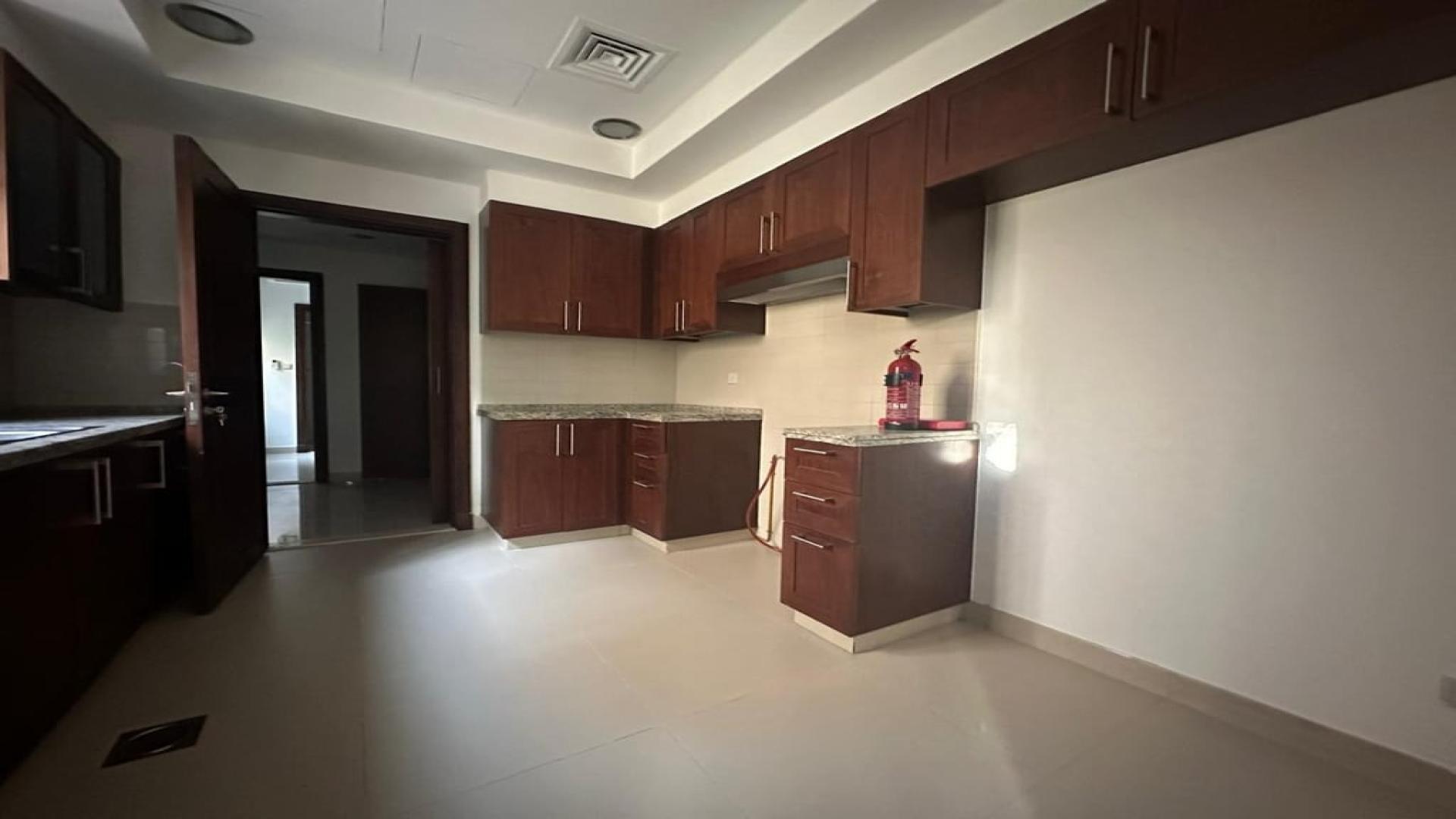 "Spacious kitchen in Samara villa, Arabian Ranches 2, with modern cabinetry and ample space.","Modern kitchen in 4-bedroom villa, Samara, Arabian Ranches 2, available for rent, LP41119.",Spacious empty living room in Samara villa, Arabian Ranches 2, available for rent