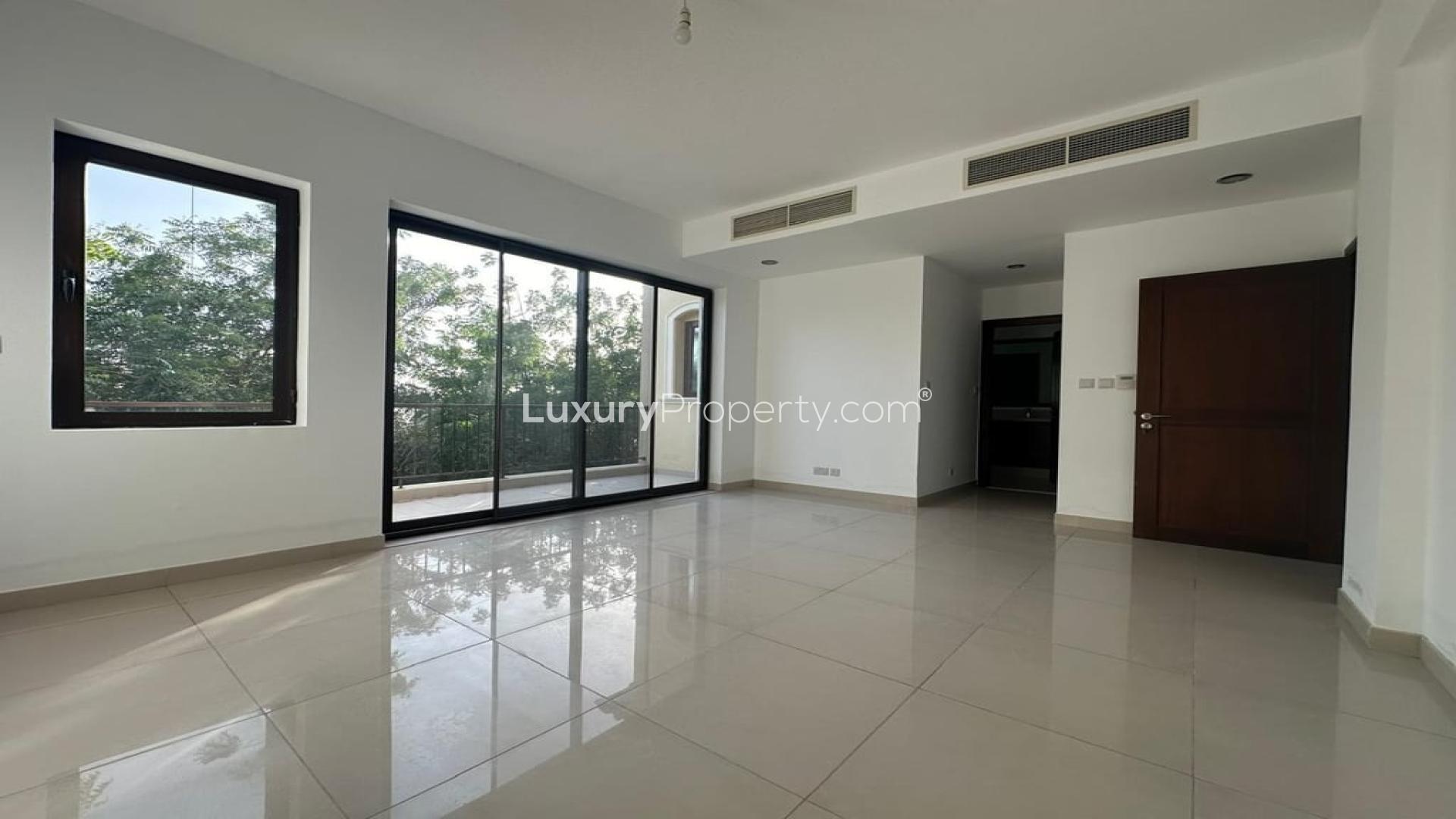 "Spacious villa backyard in Samara, Arabian Ranches 2, with lush greenery and patio area.",Vacant villa interior with large windows, Samara, Arabian Ranches 2, 4 bedrooms, for rent