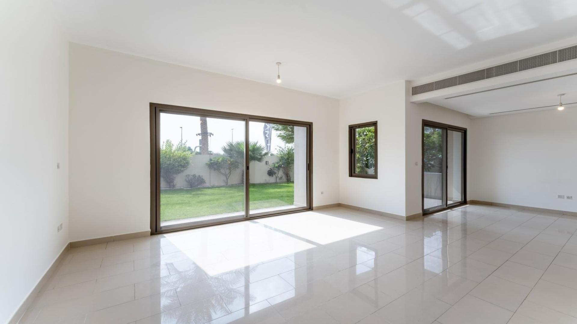 Bright living room with garden view in Azalea villa, Arabian Ranches 2