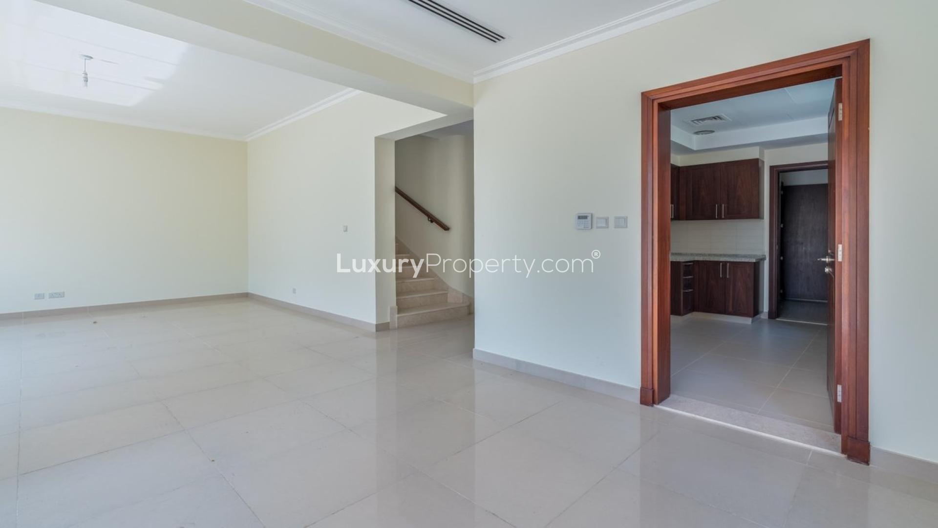 "Elegant stairway and hallway in 4-bed villa, Samara, Arabian Ranches 2, available for rent.",Spacious living area in 4-bed villa, Arabian Ranches 2, Samara, available for rent