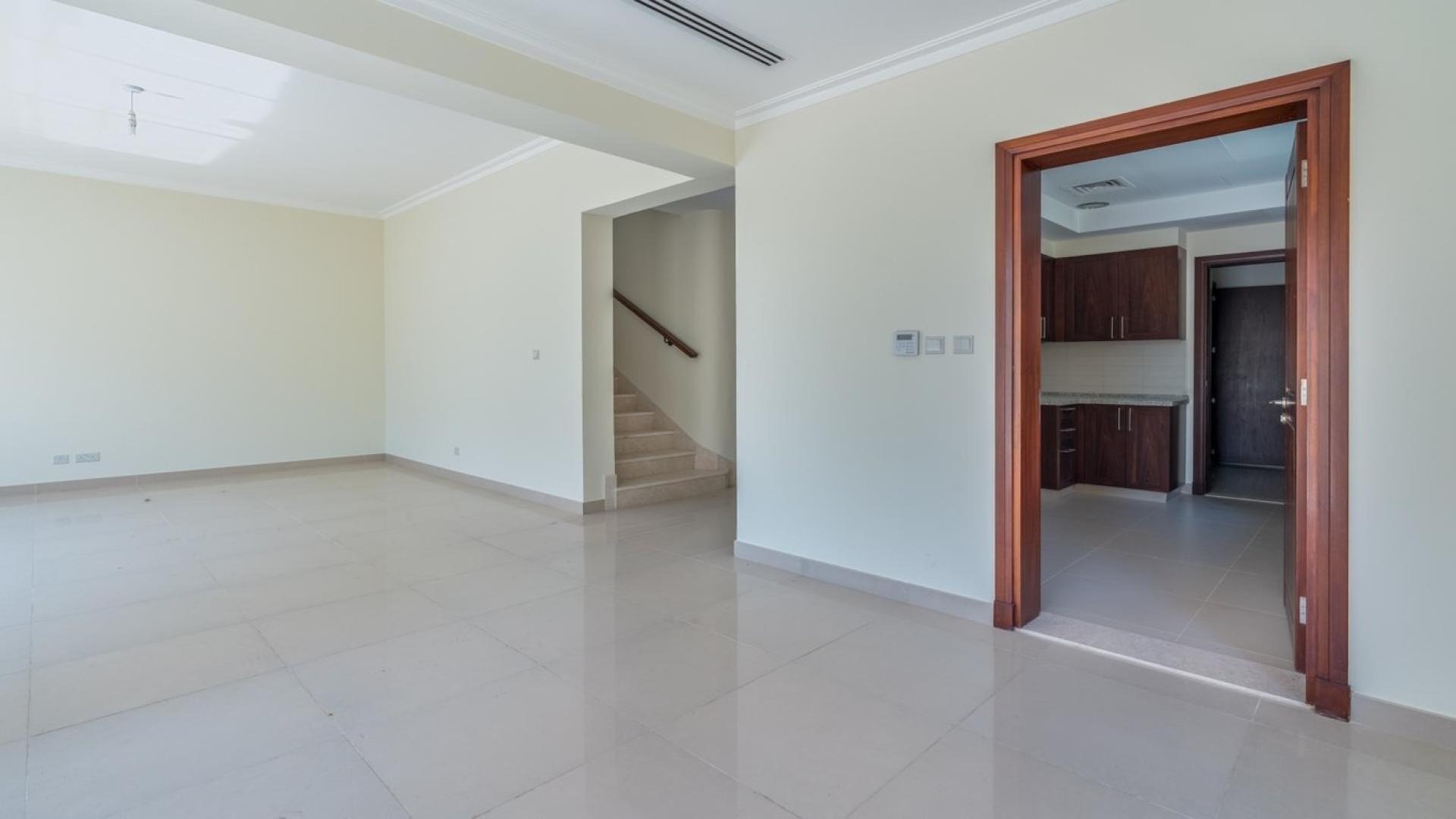 "Elegant stairway and hallway in 4-bed villa, Samara, Arabian Ranches 2, available for rent.",Spacious living area in 4-bed villa, Arabian Ranches 2, Samara, available for rent
