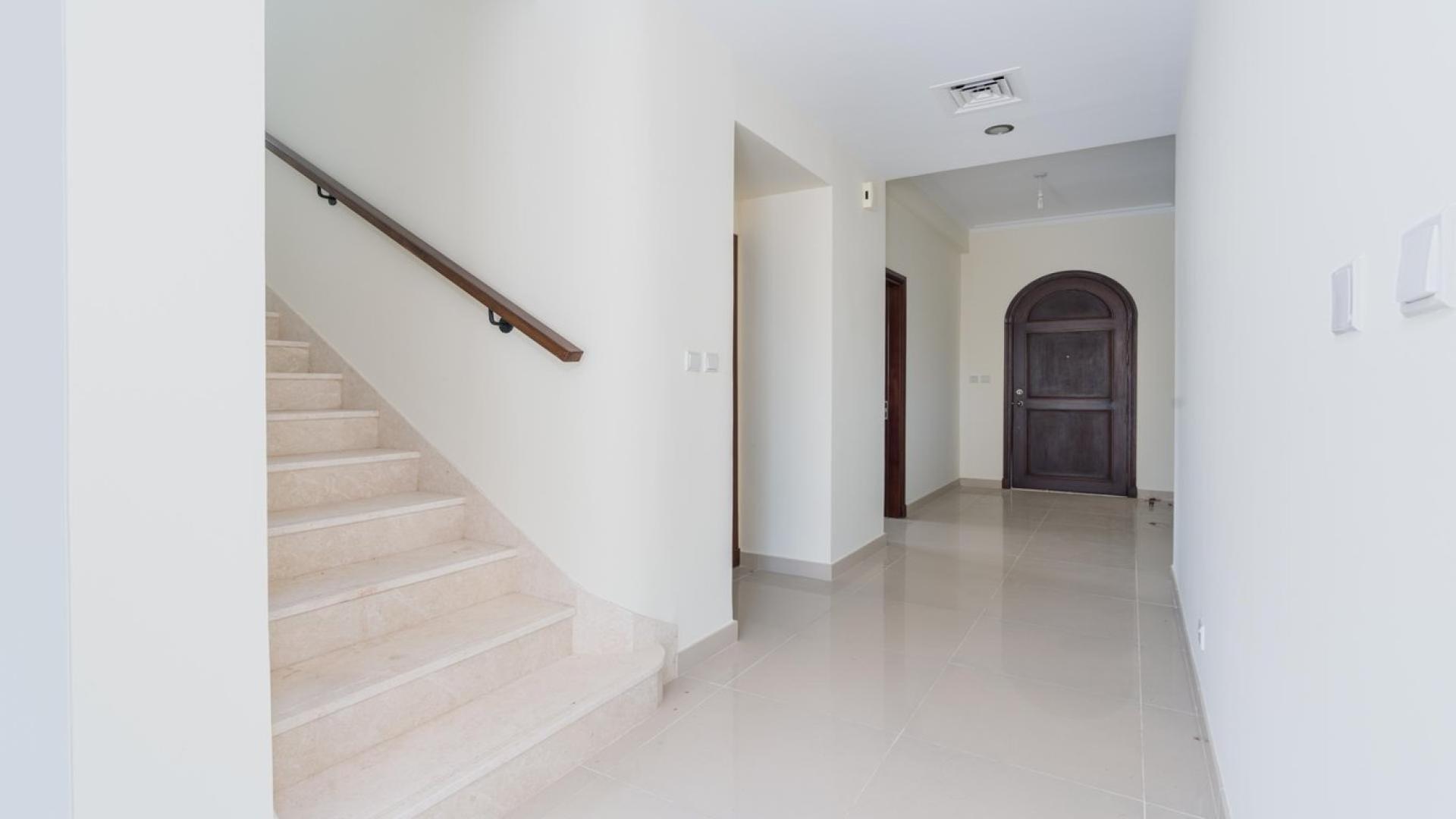 Spacious living room in 4-bed villa, Samara, Arabian Ranches 2, with large windows and tile flooring