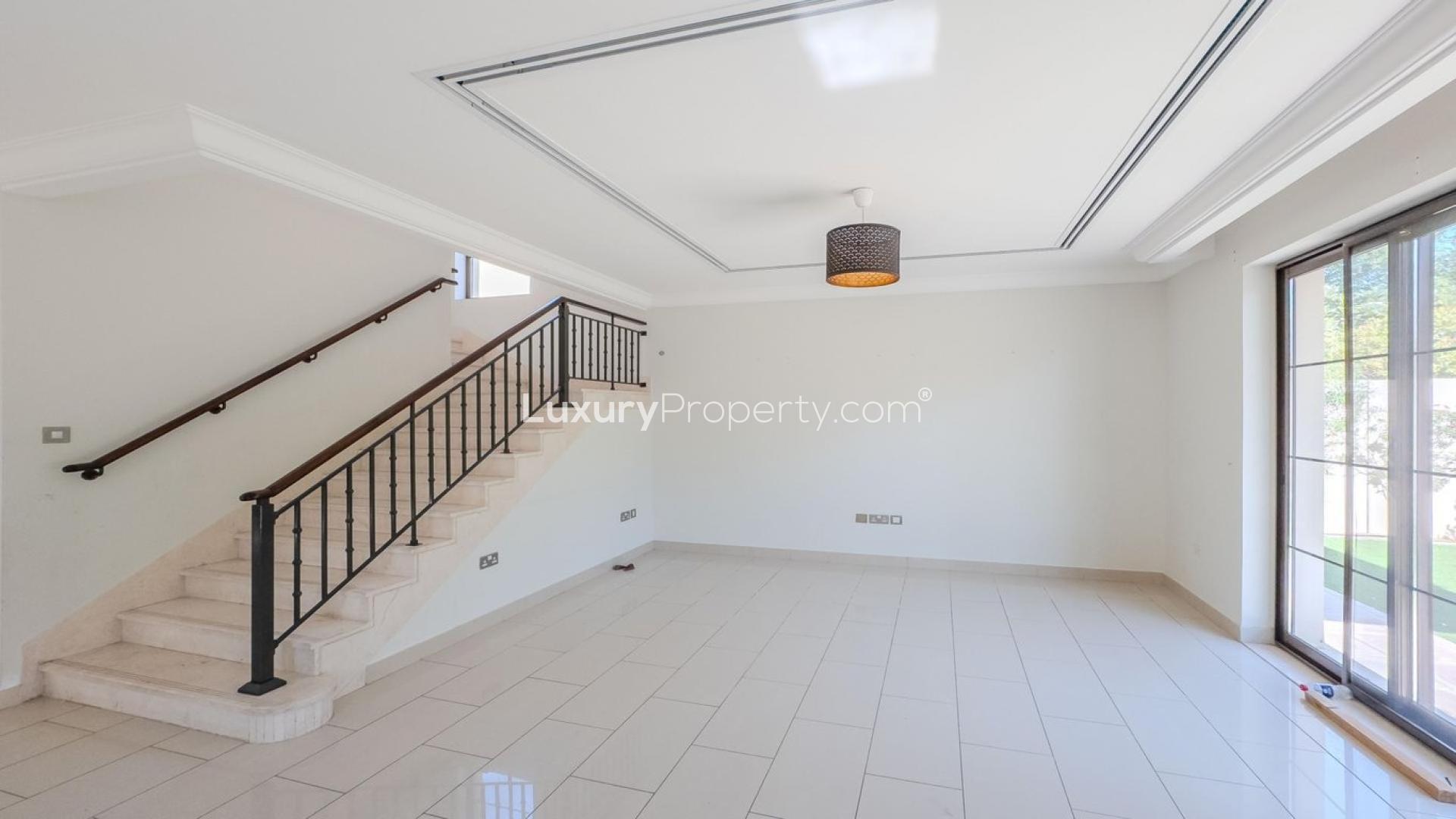 Bright living room with stairs and garden view in Arabian Ranches 2 villa