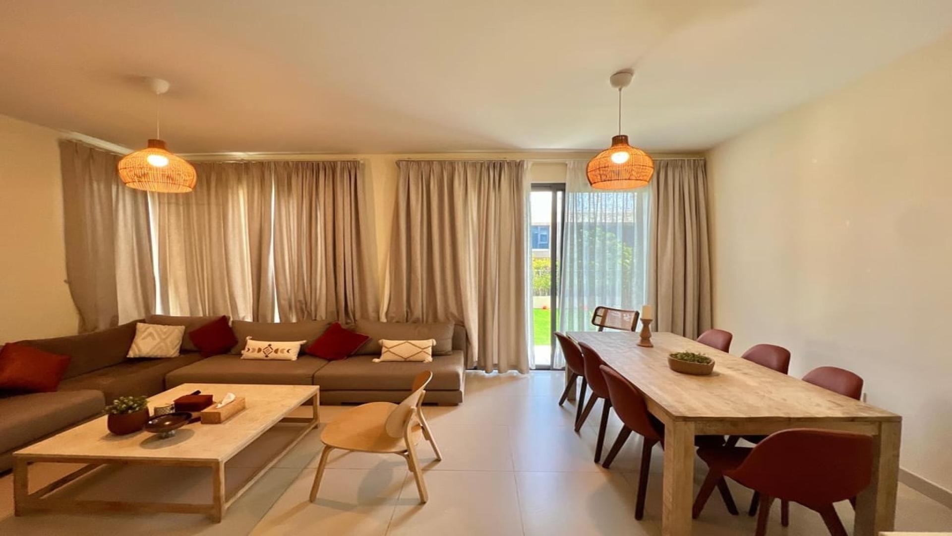 Spacious villa exterior with lush garden in Maple, Dubai Hills Estate for rent