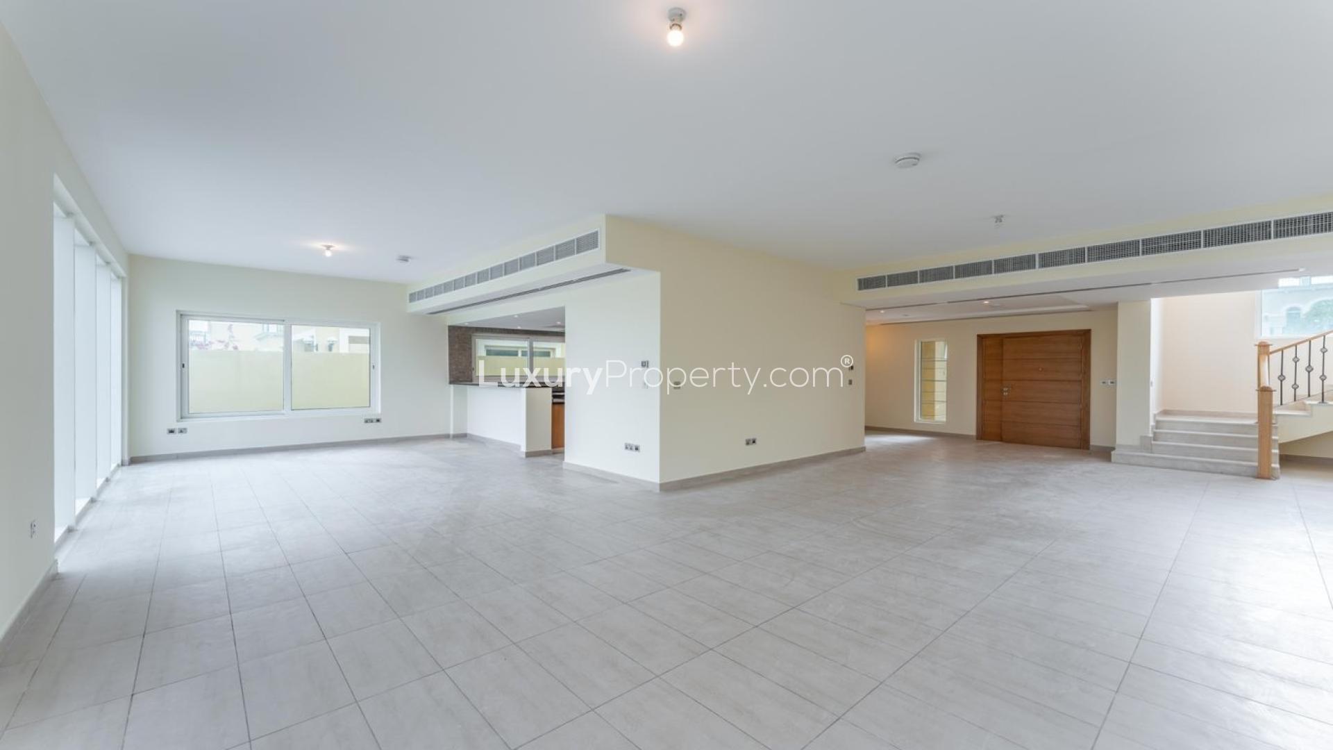 Spacious living room in Jumeirah Park villa with garden view, Legacy Nova Villas