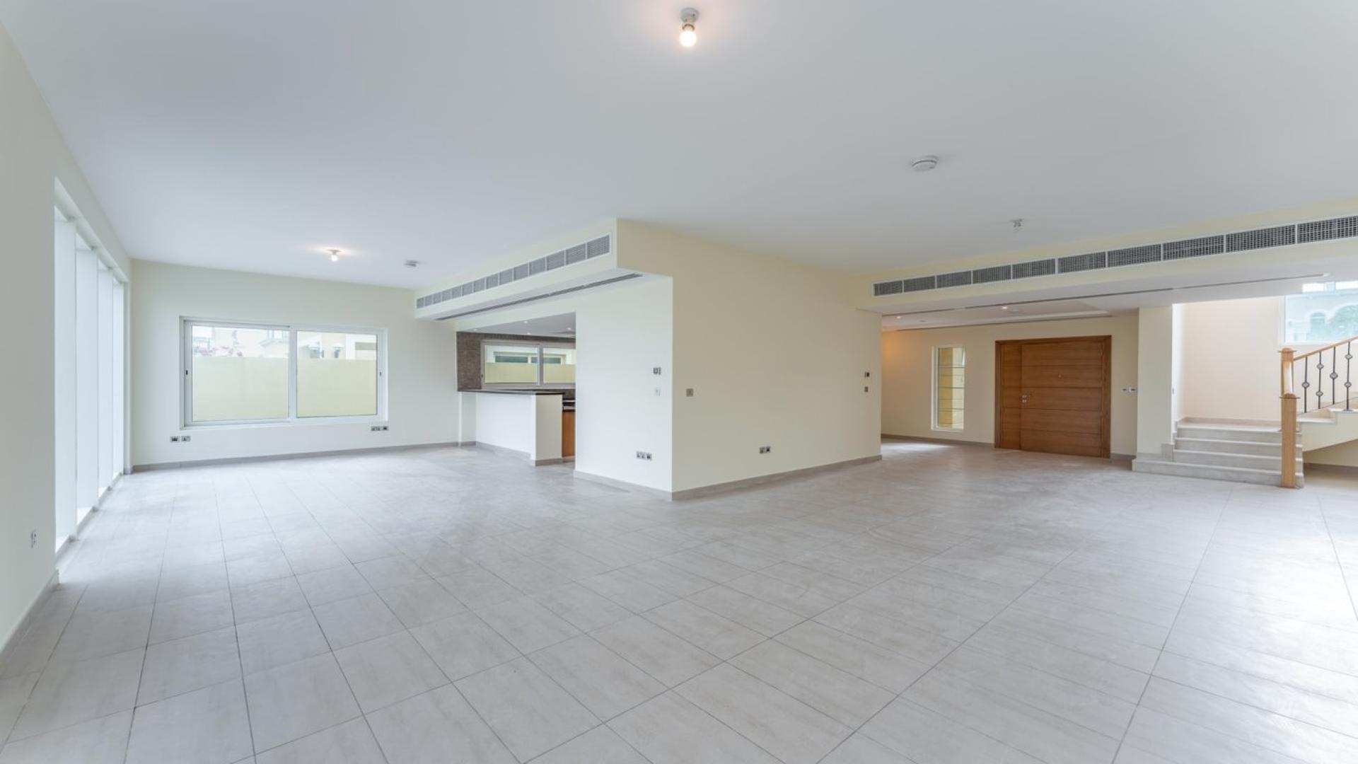 Spacious living room in Jumeirah Park villa with garden view, Legacy Nova Villas