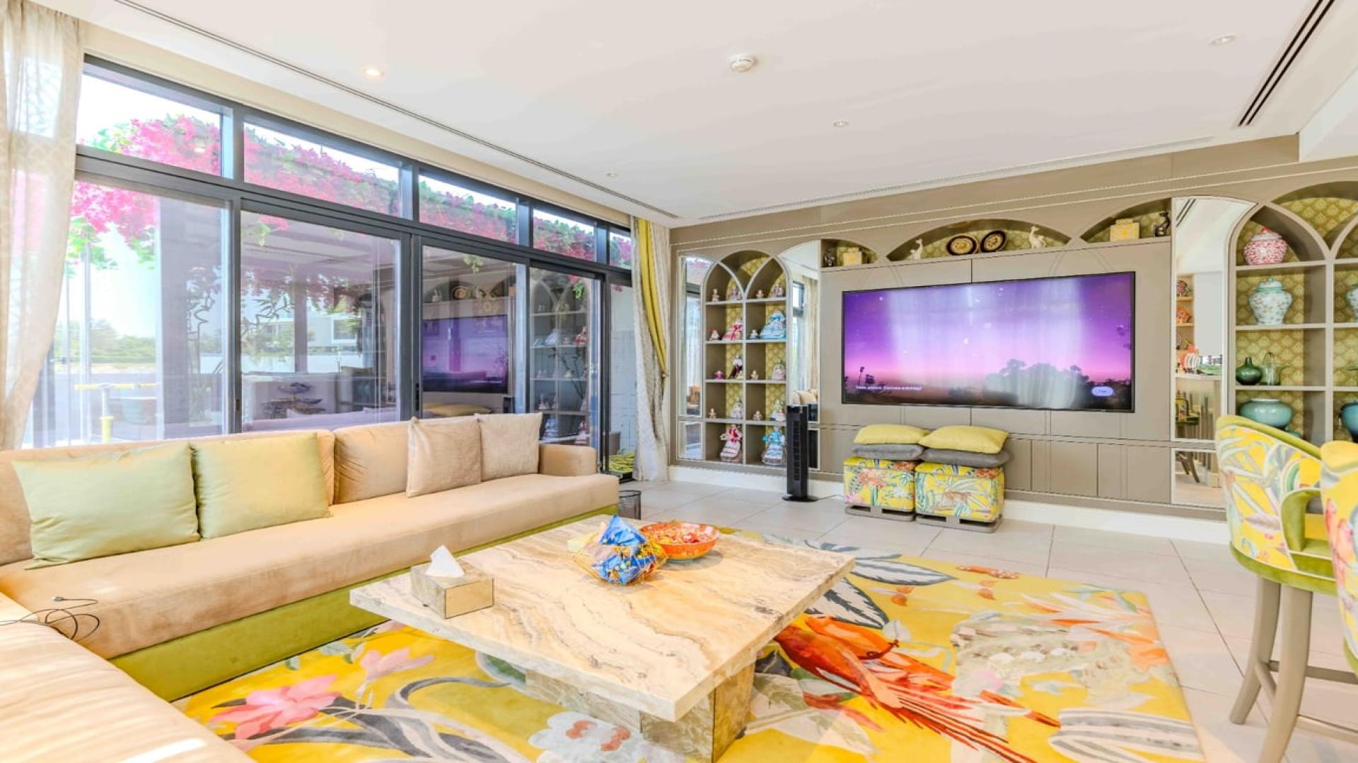 Modern open-plan living room and kitchen in a fully furnished Jumeirah Luxury villa