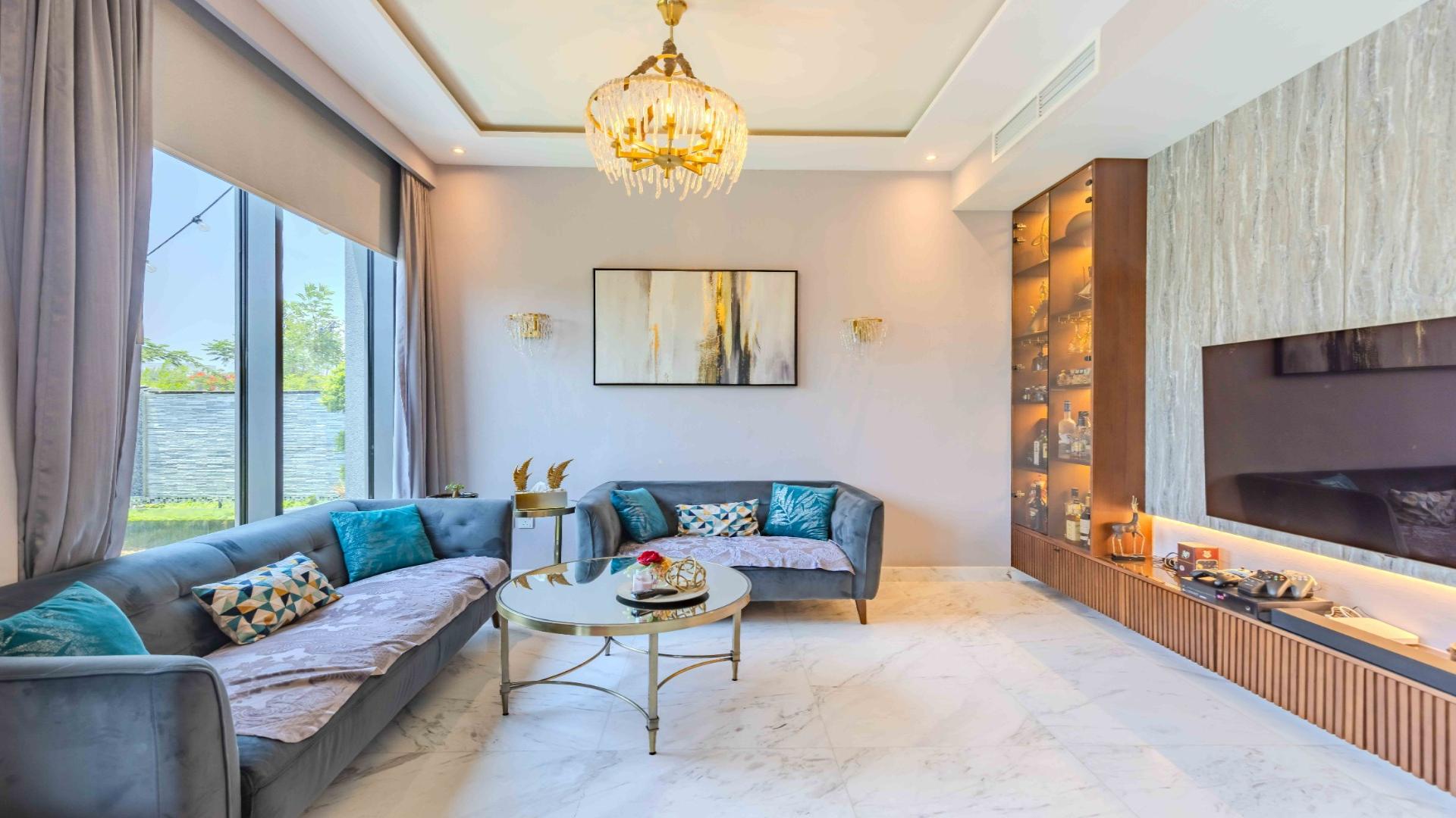 Luxurious living room in upgraded villa, Maple at Dubai Hills Estate, with modern furnishings