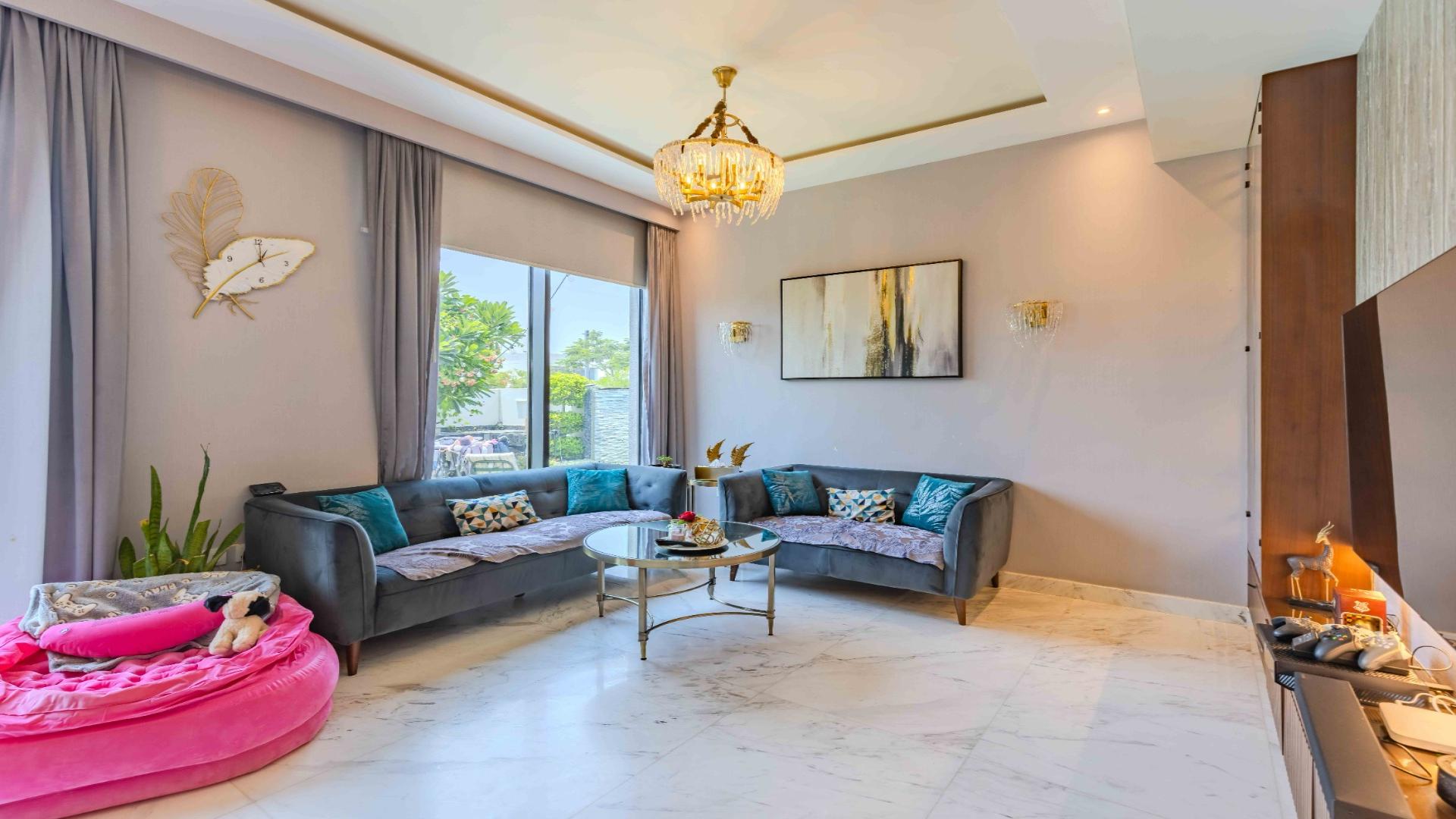 Luxurious living room in upgraded villa, Dubai Hills Estate, with elegant furnishings and decor