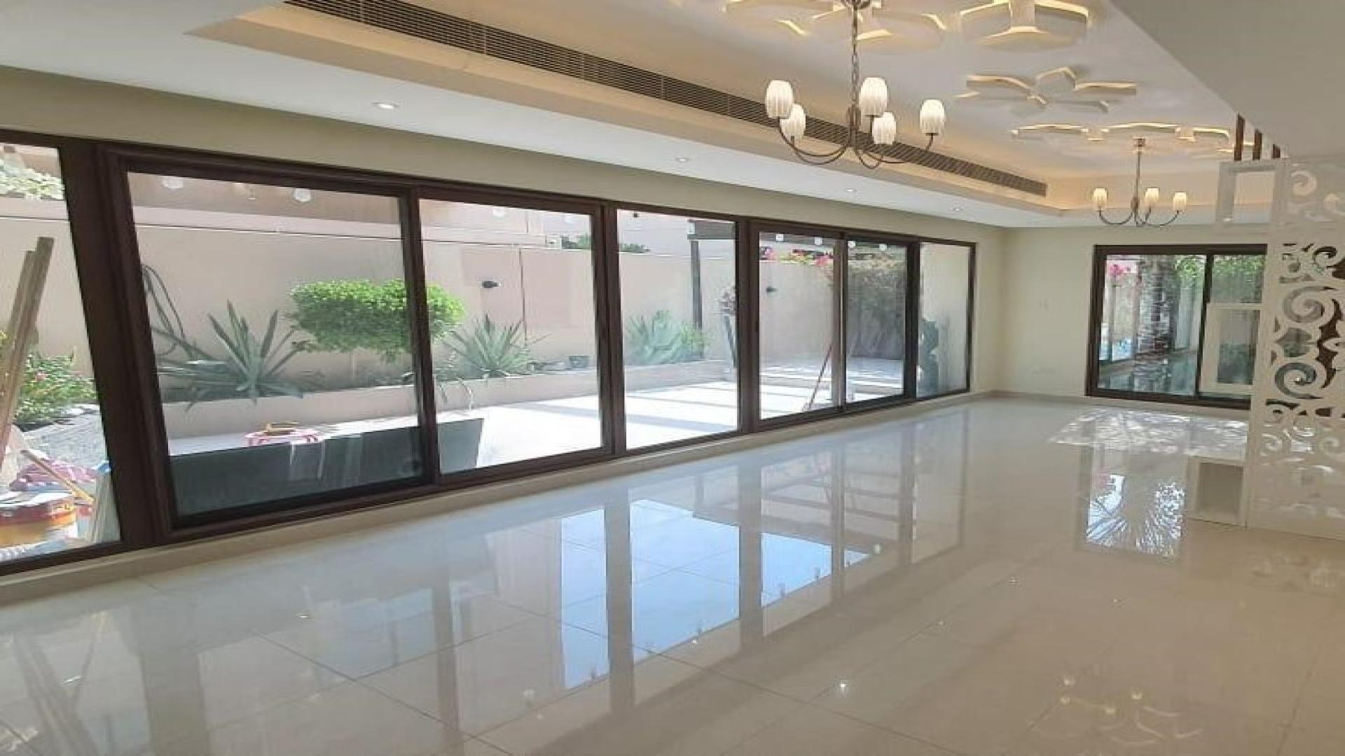 Elegant 4-bedroom villa exterior in Meydan Gated Community, featuring modern design and lush greenery
