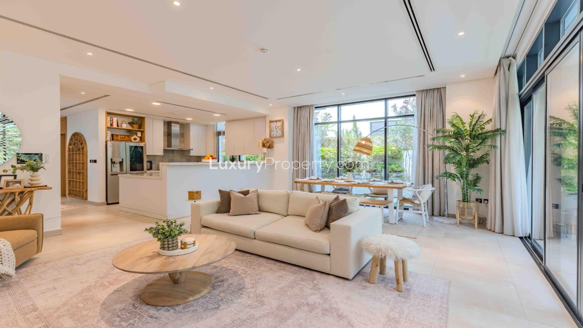 Outdoor seating area with lush garden in Jumeirah Luxury villa for rent