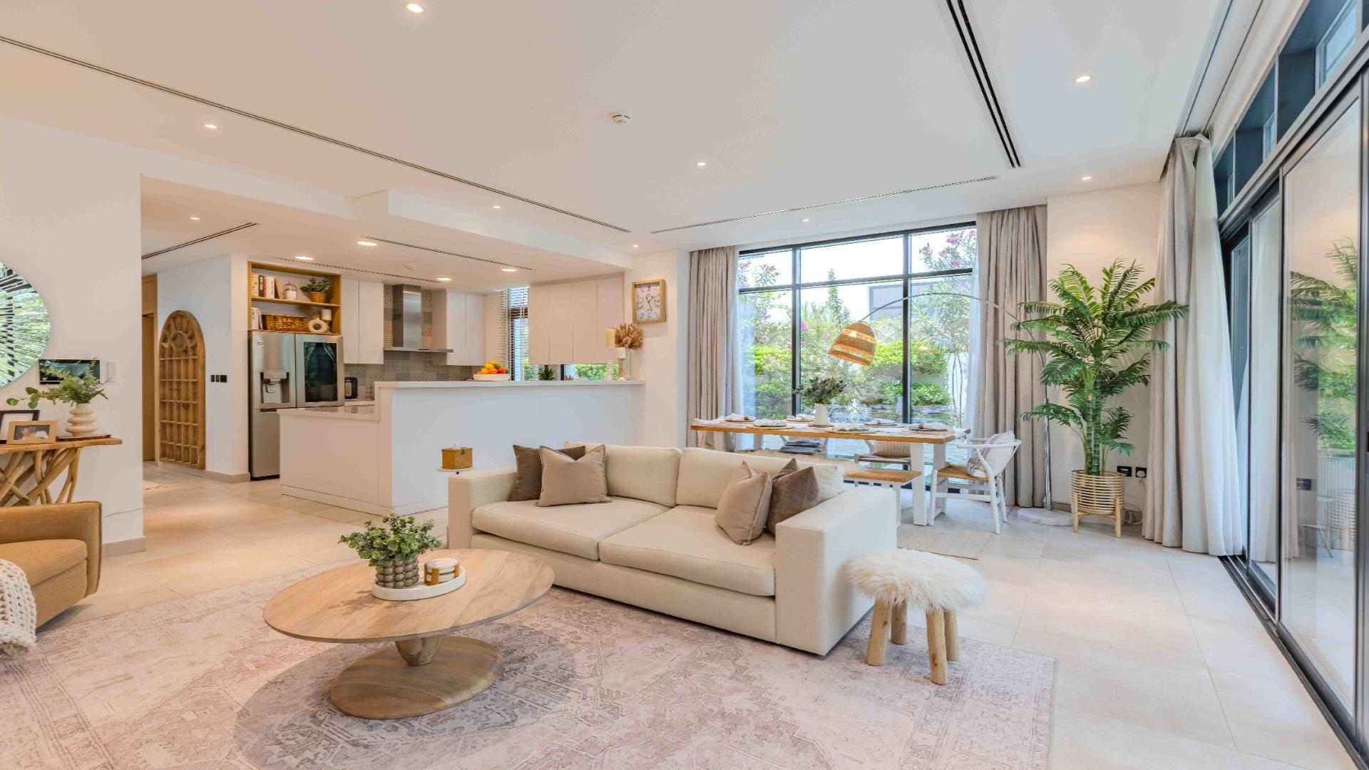 Outdoor seating area with lush garden in Jumeirah Luxury villa for rent