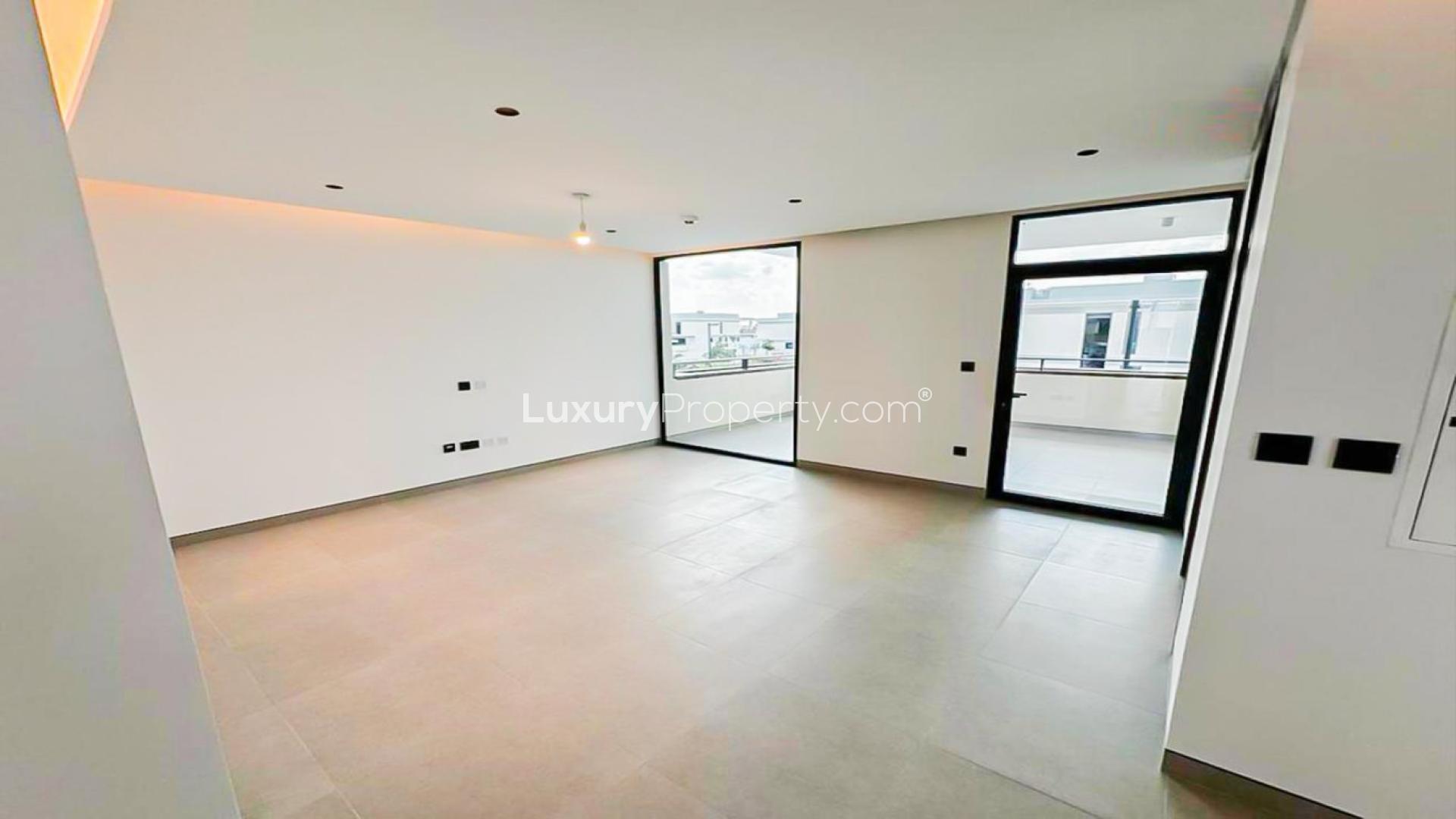 Spacious living room in 4-bed villa, Harmony 1, Tilal Al Ghaf, with large windows