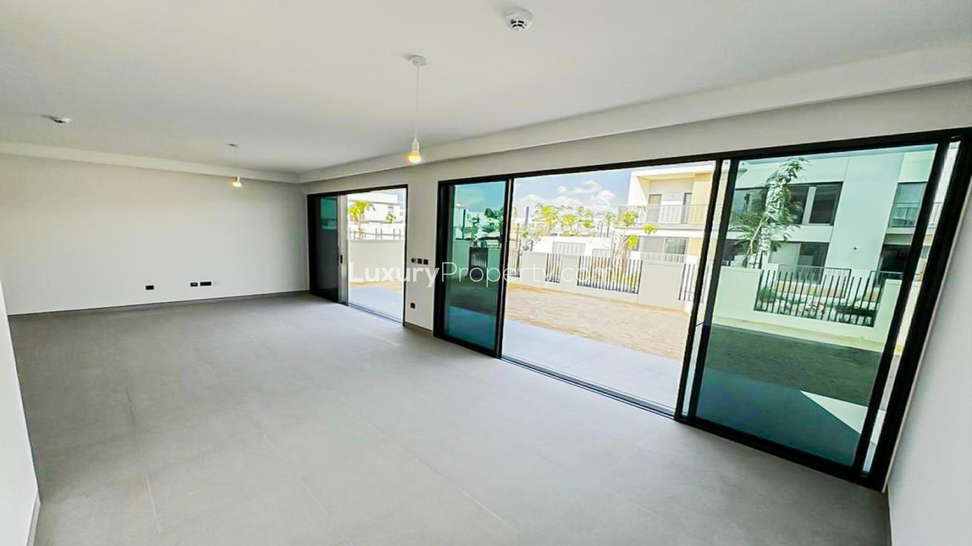 Spacious living area in 4-bed villa, Tilal Al Ghaf, Harmony community, modern design