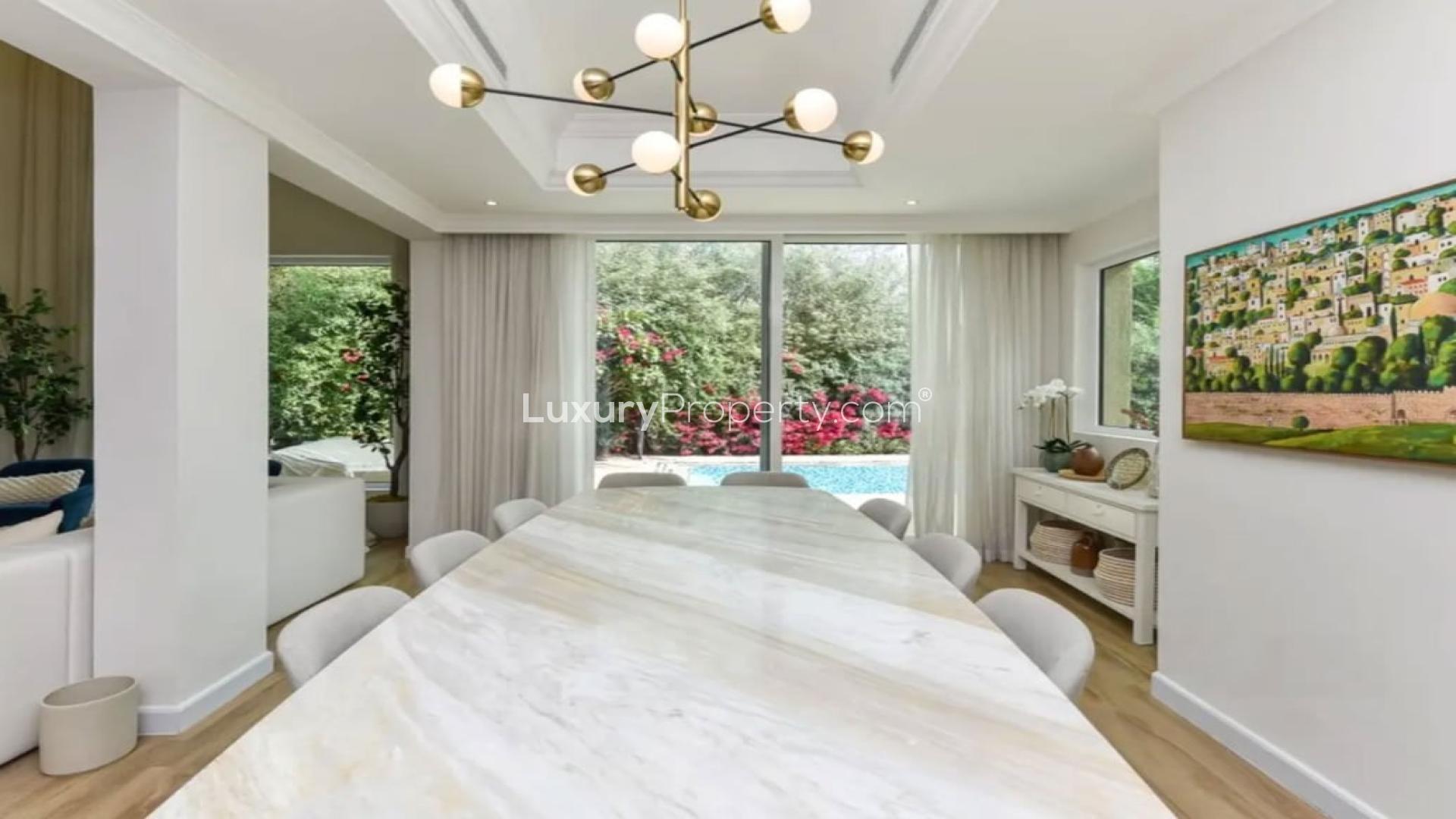 Luxurious living room in Jumeirah Islands villa, featuring modern decor and spacious layout