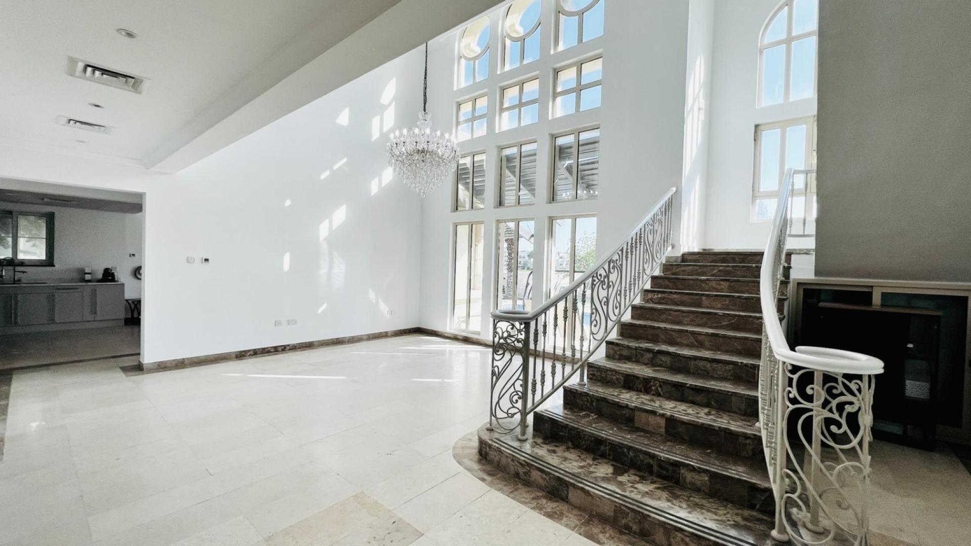 Luxurious villa interior with marble floors and staircase in Jumeirah Islands, Dubai