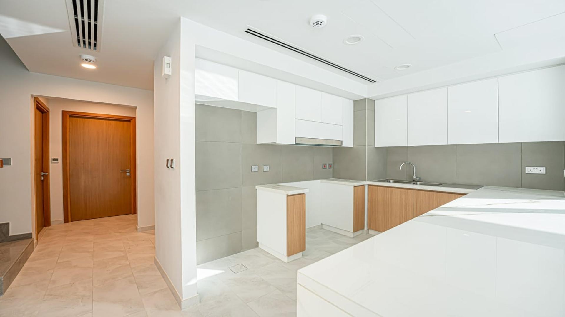 Modern kitchen with large windows in 4-bedroom villa, La Rosa, Dubai Land