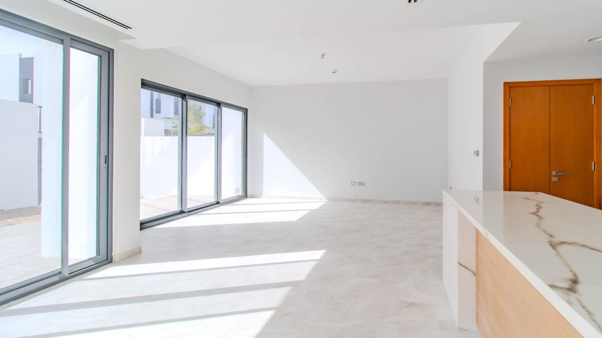 Modern kitchen in 4-bedroom villa, Villanova, Dubai Land, with sleek countertops and cabinetry