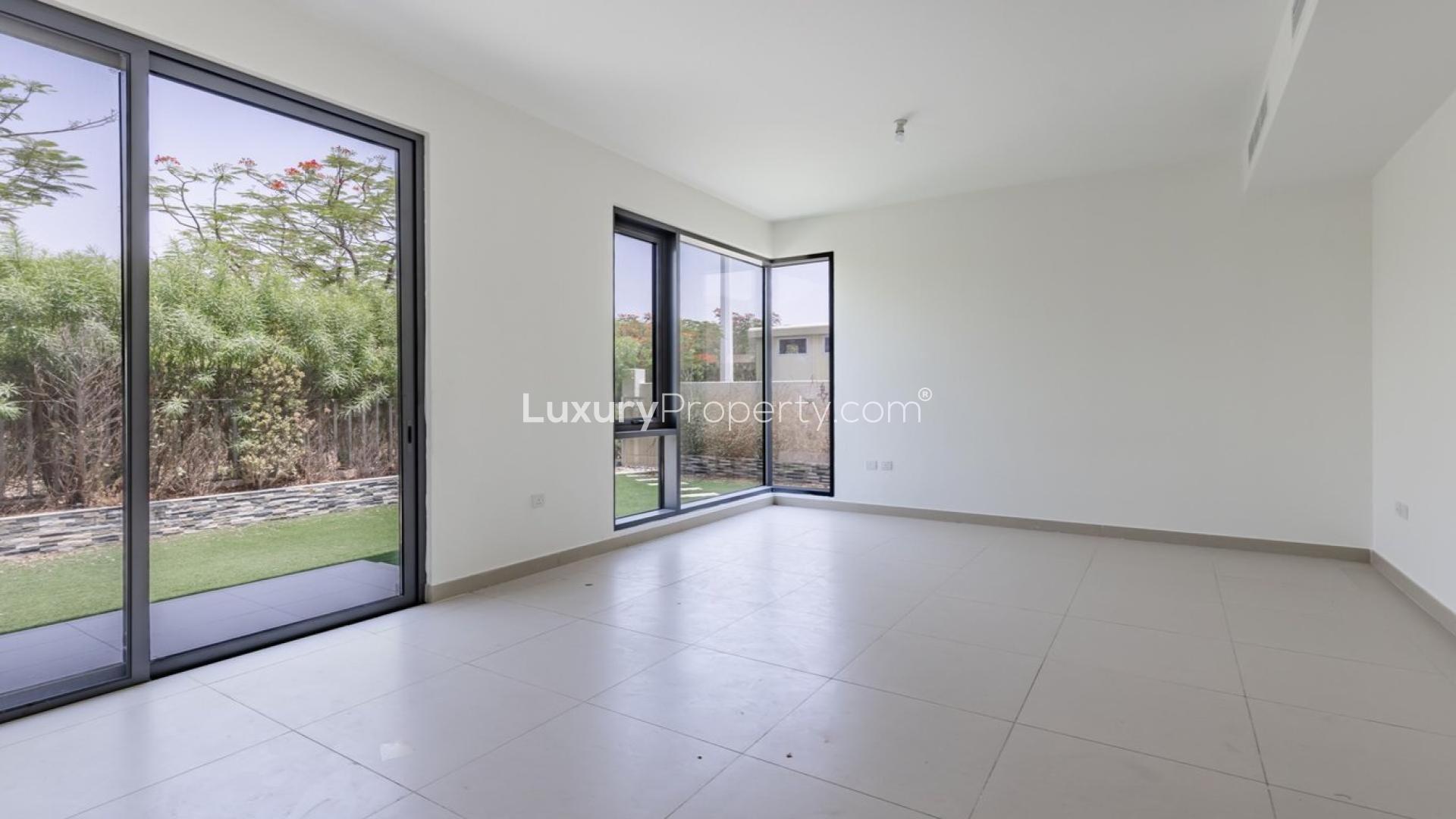 Exterior view of 4-bedroom villa in Maple 3, Dubai Hills Estate with green lawn