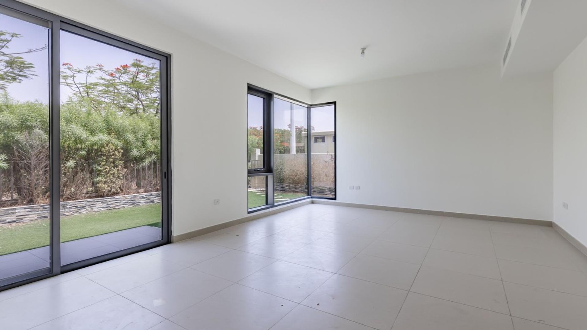 Exterior view of 4-bedroom villa in Maple 3, Dubai Hills Estate with green lawn