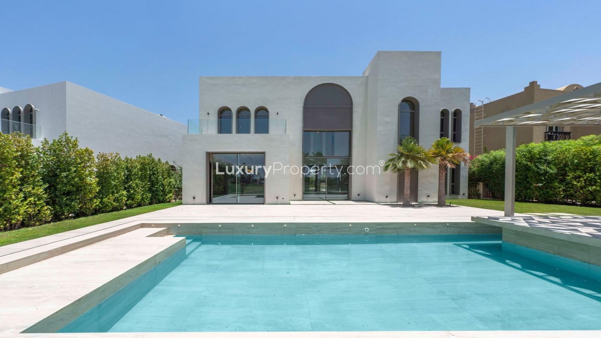Luxury villa pool with stunning lake view in Jumeirah Islands' Islamic Clusters