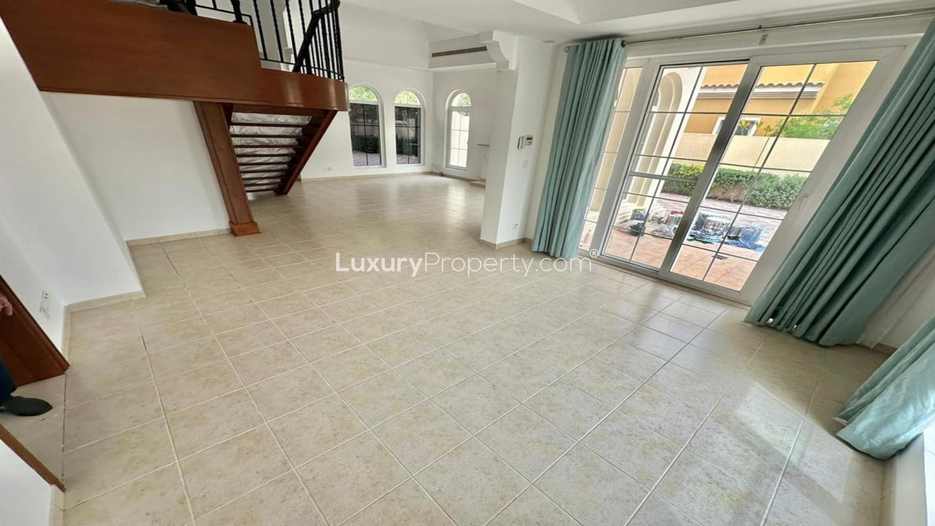 Elegant living room with fireplace and large windows in Mirador La Coleccion villa