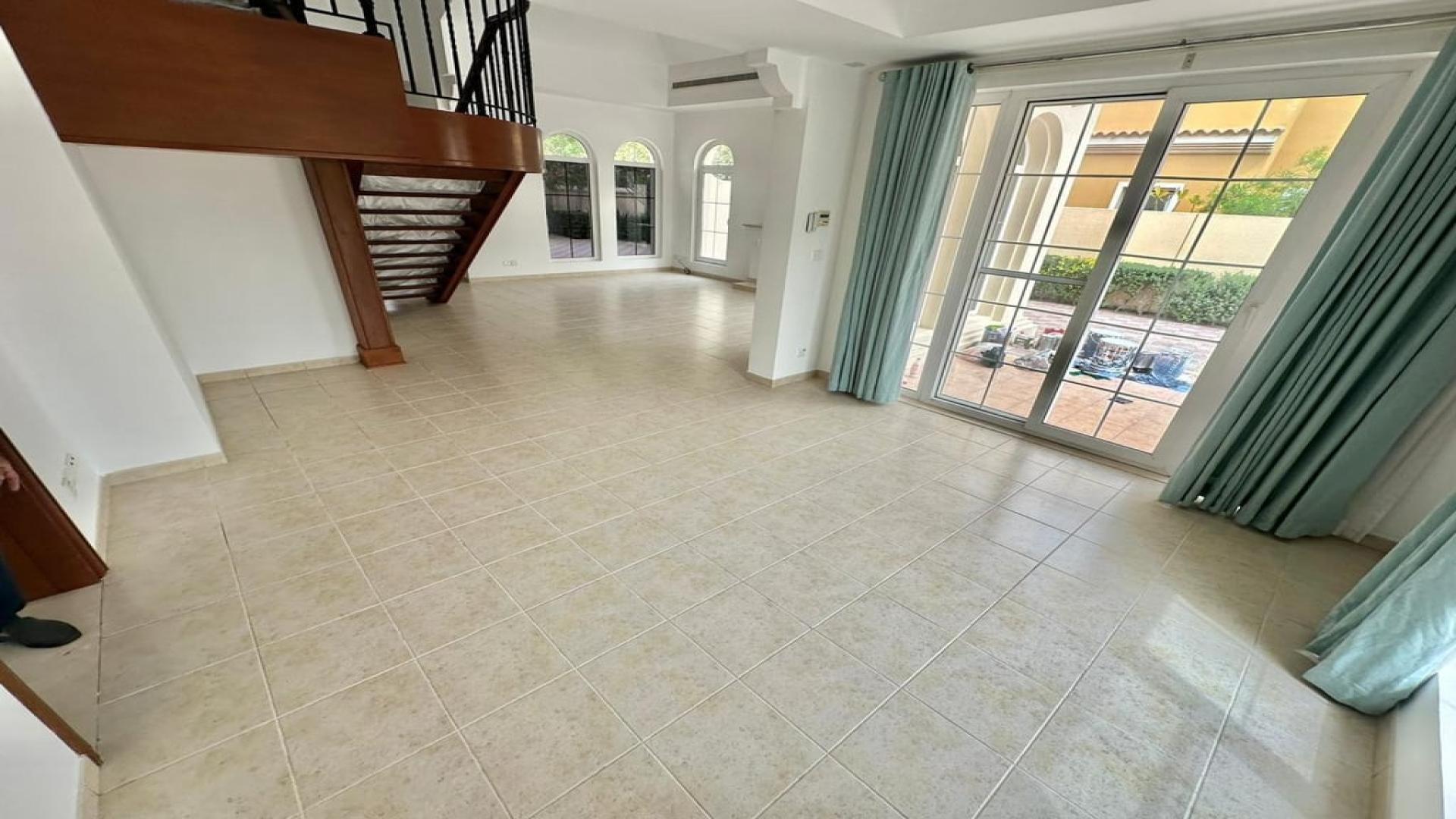 Elegant living room with fireplace and large windows in Mirador La Coleccion villa