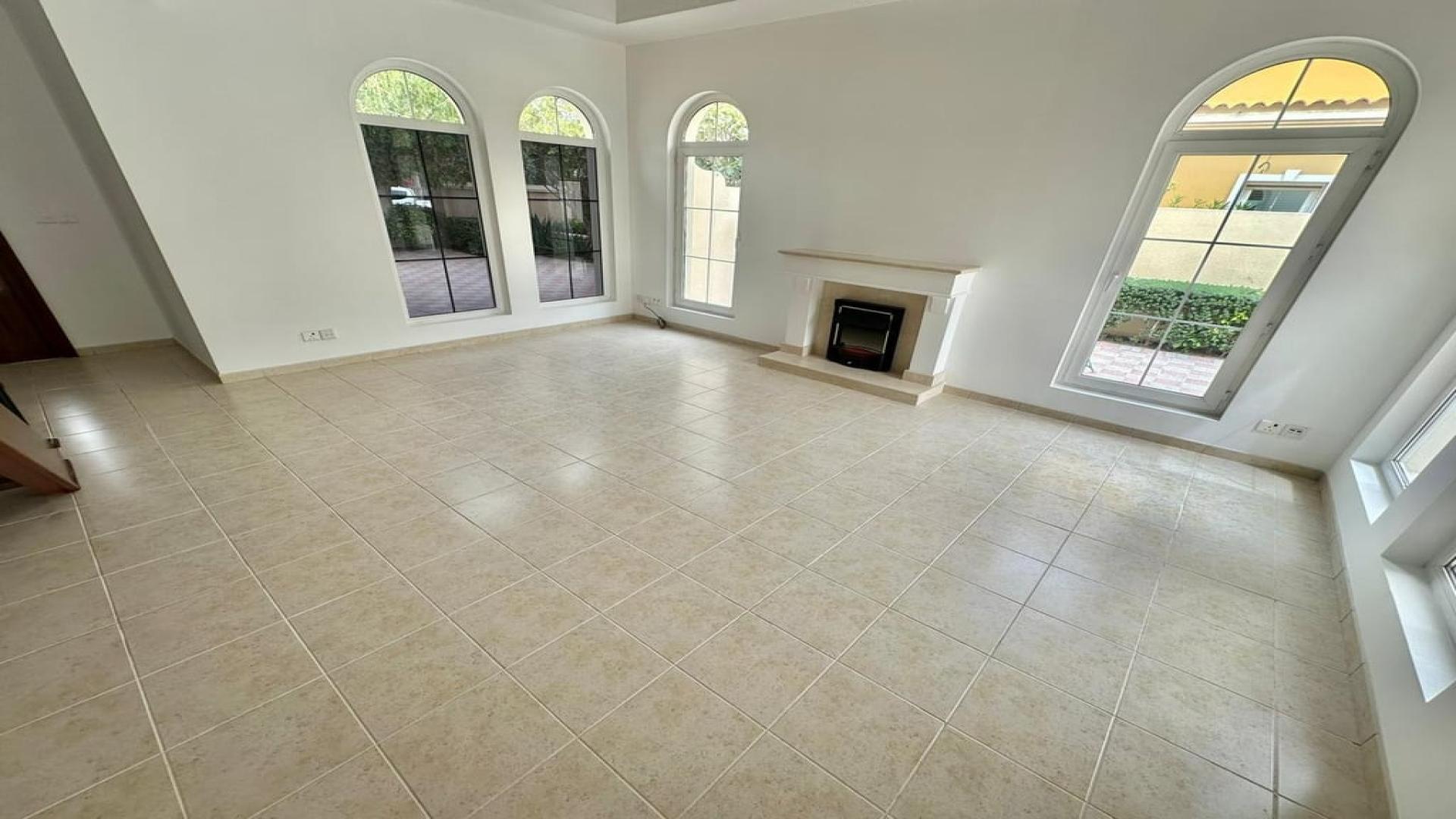 Bright living room with large windows in Mirador La Coleccion villa, Arabian Ranches