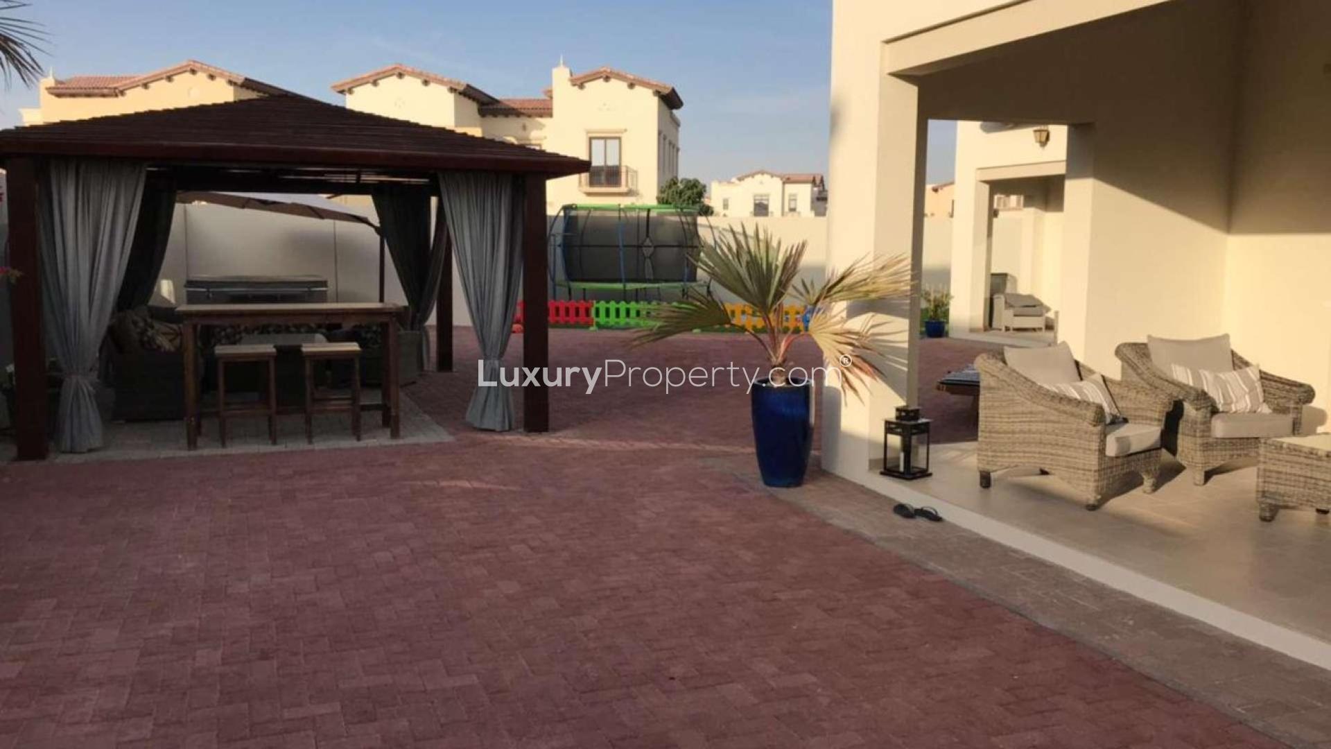 Spacious garden of villa in Arabian Ranches 2, Rosa community, featuring potted plants