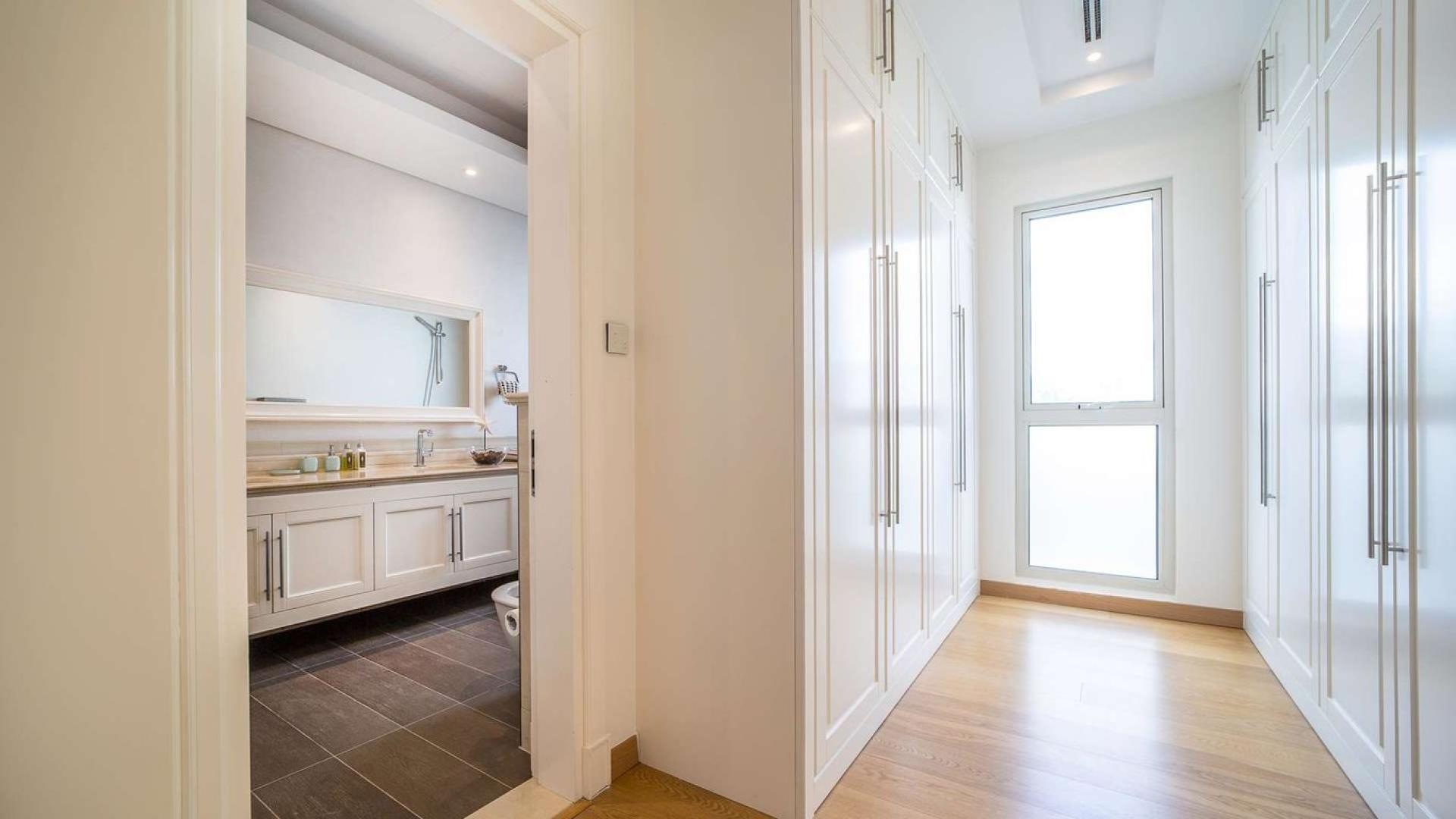 Luxury Mediterranean villa exterior, 4 bedrooms, District One, MBR City, lush greenery, for sale