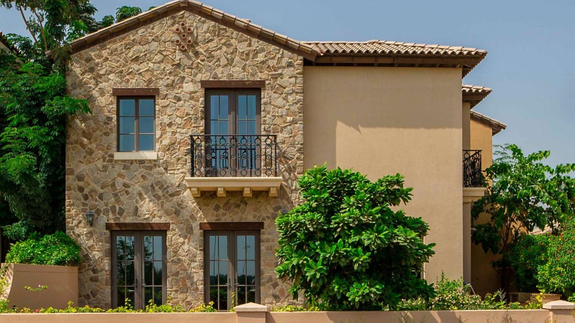 Elegant Muirfield Villa exterior with garden, Whispering Pines, Jumeirah Golf Estates, for sale