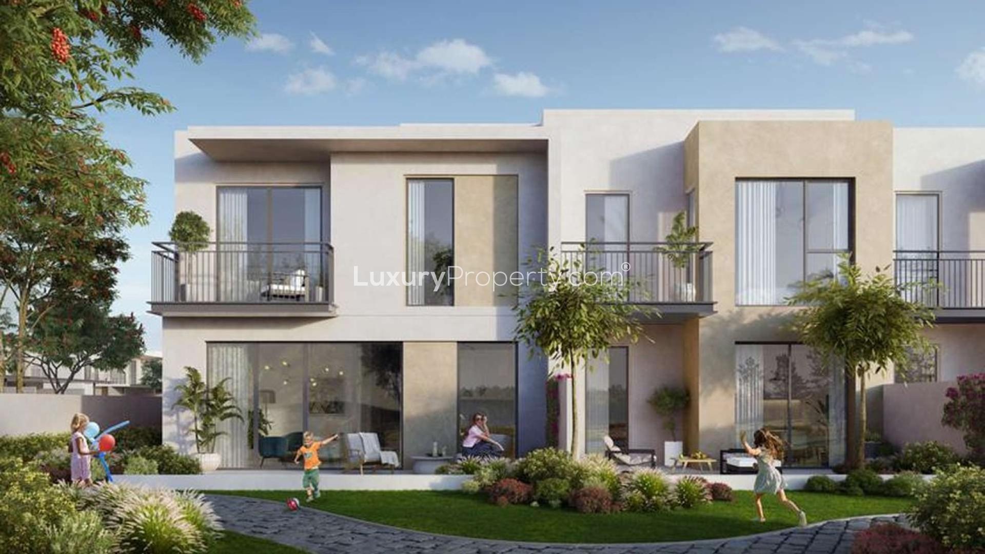 Contemporary three-bedroom townhouse exterior in Camelia, Arabian Ranches 2, with landscaped garden