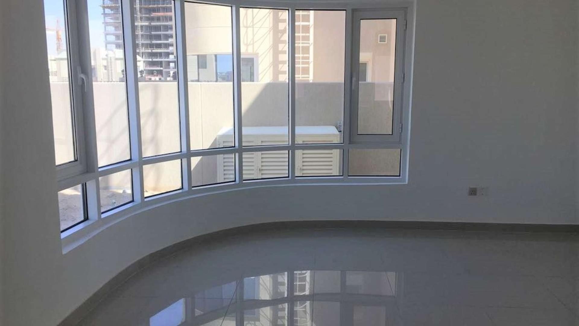 Bright living room with large windows in Dubailand villa, Living Legends community