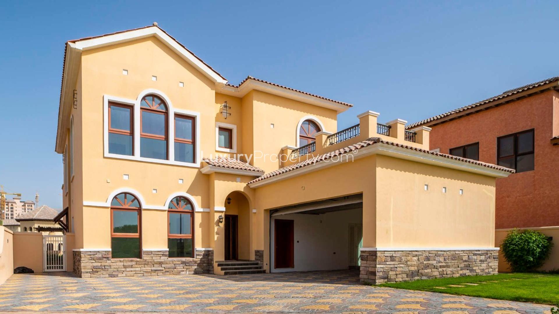 Tuscan-style villa exterior in Jumeirah Golf Estates, four bedrooms, for sale, Orange Lake