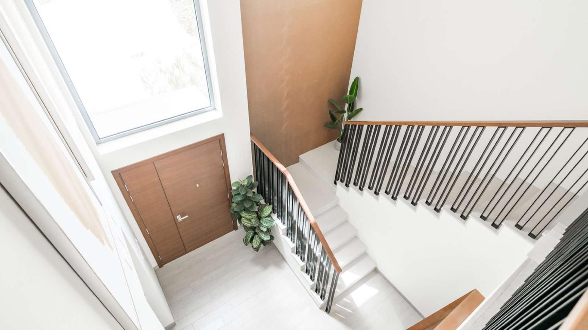 Elegant living room in Emaar South villa with modern decor and natural light