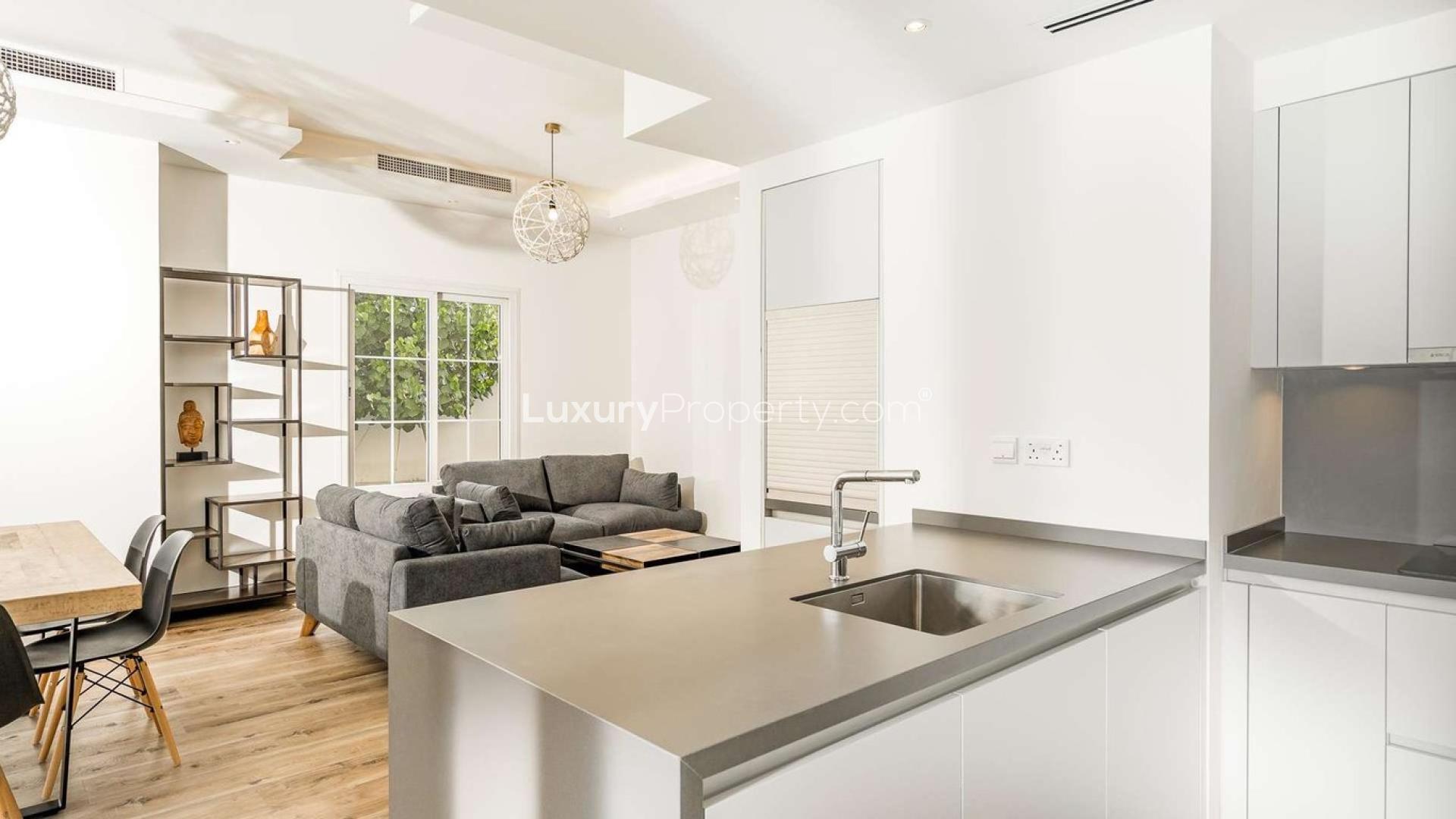 Dining area with garden view in renovated villa, The Lakes, Dubai