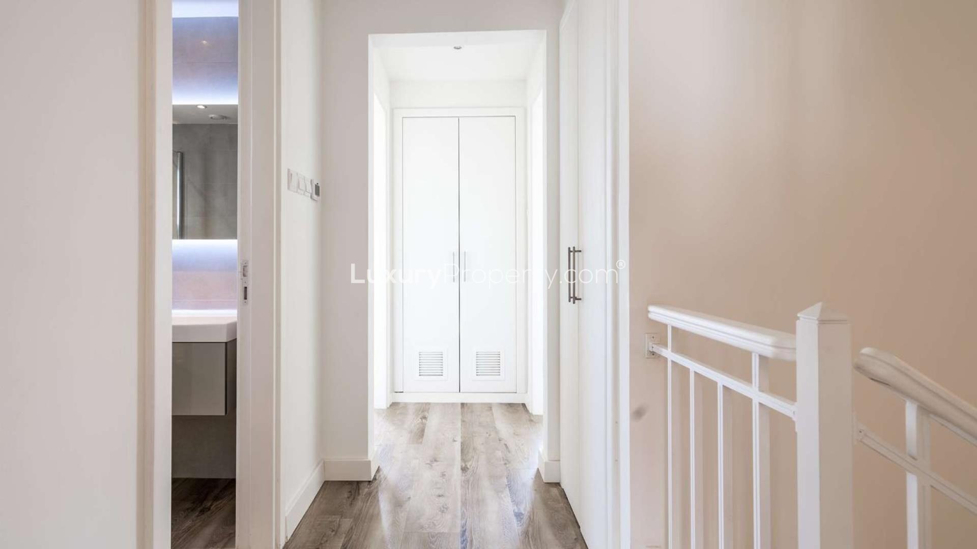 Luxurious living room in renovated 4-bedroom villa, The Lakes, Dubai, with garden views