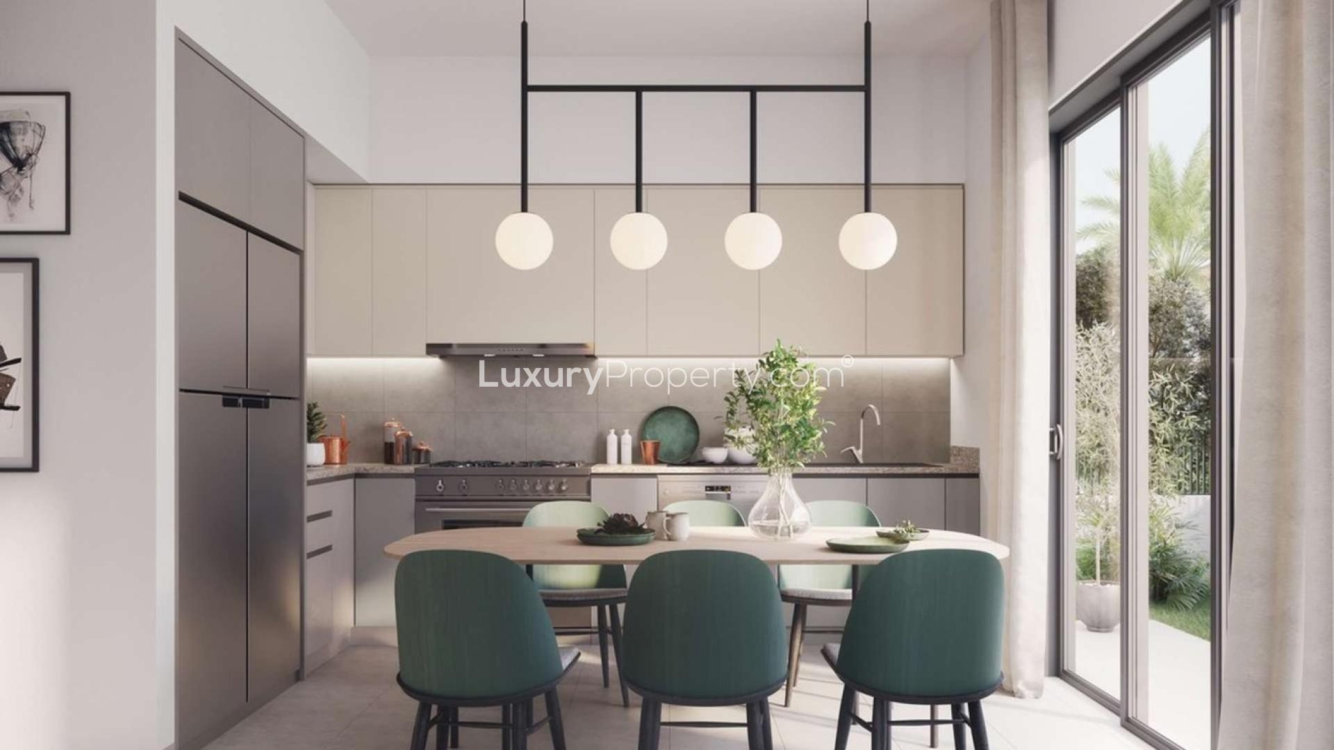 "Modern studio villa interior with garden view, Greenview 2, EMAAR South, Dubai South.",Modern kitchen interior in Greenview 2 villa, EMAAR South, Dubai South, with dining area