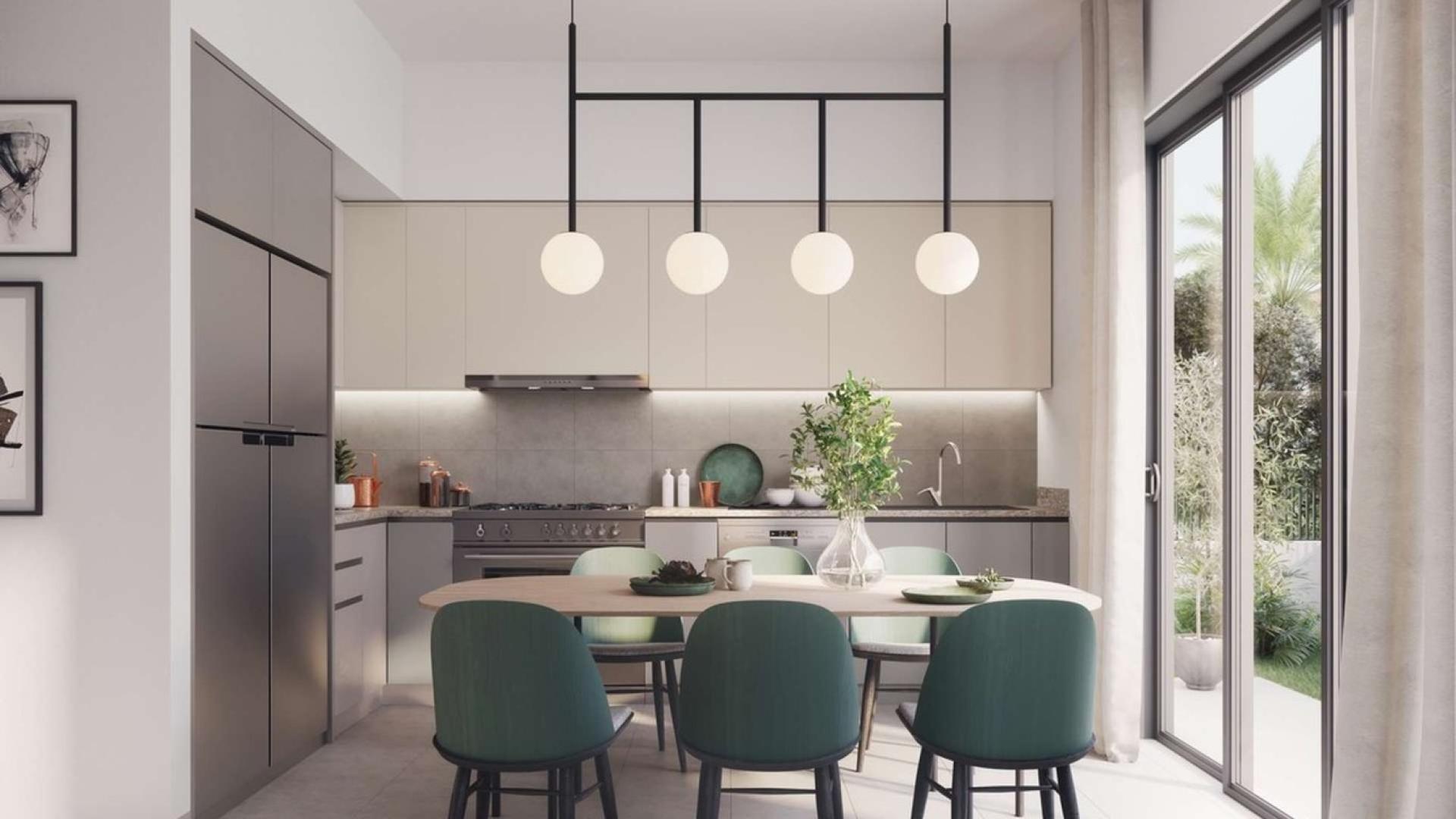 Spacious villa exterior in Greenview 2, Emaar South, Dubai with car and palm trees