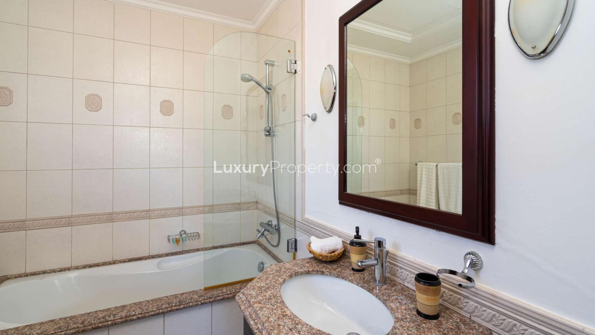 Luxurious living room with skyline views in Palm Jumeirah beachfront villa for sale